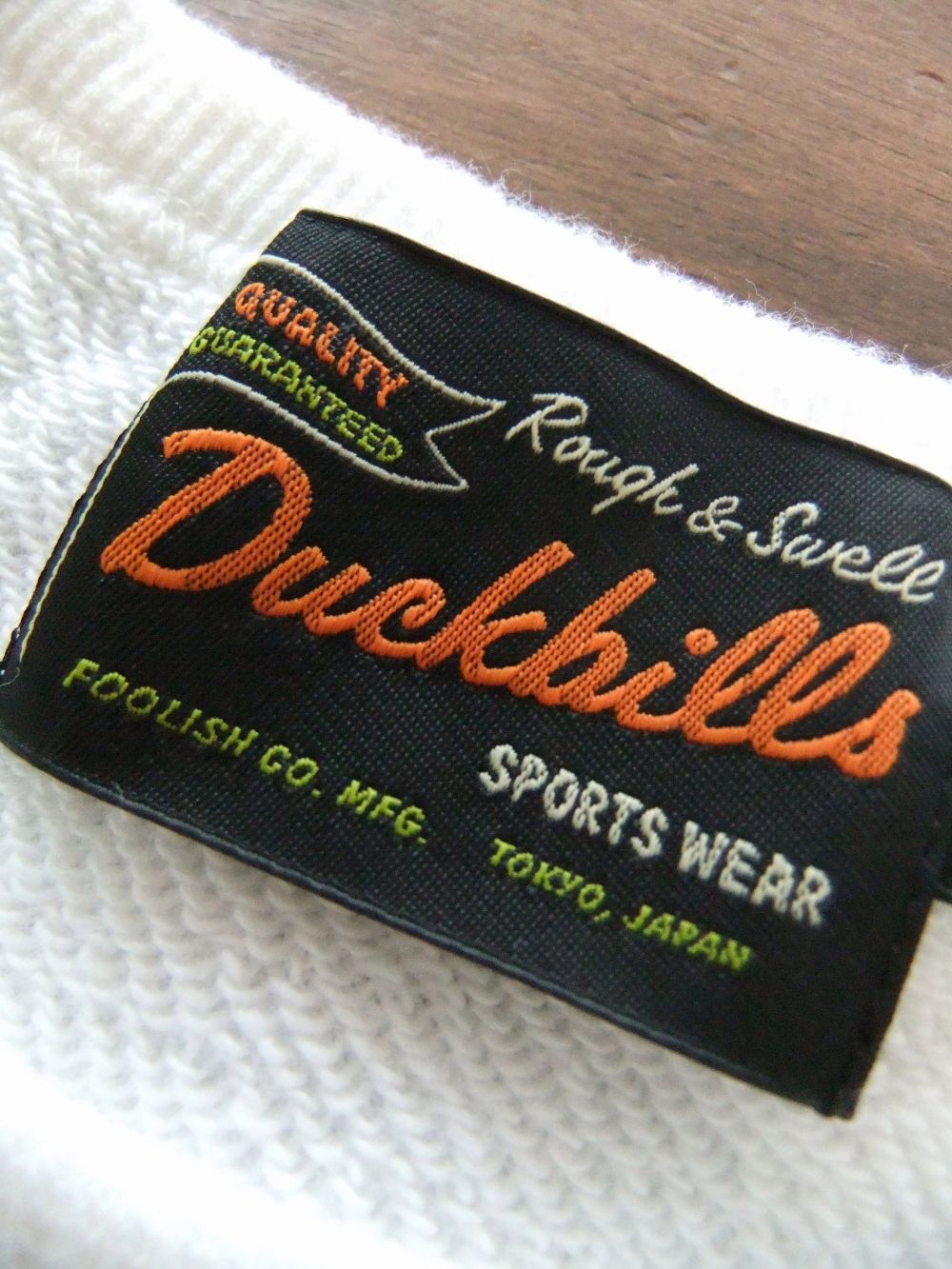POOR DUCKBILL SWEAT  (ホワイト) ロゴ入りトレーナー   RSM-23040