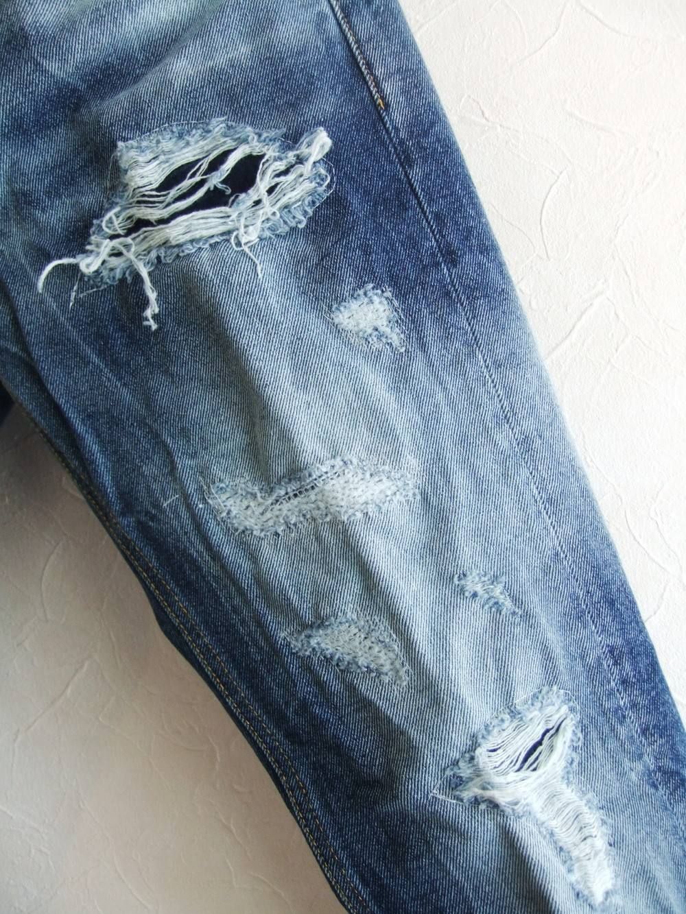 DAMAGE JEANS