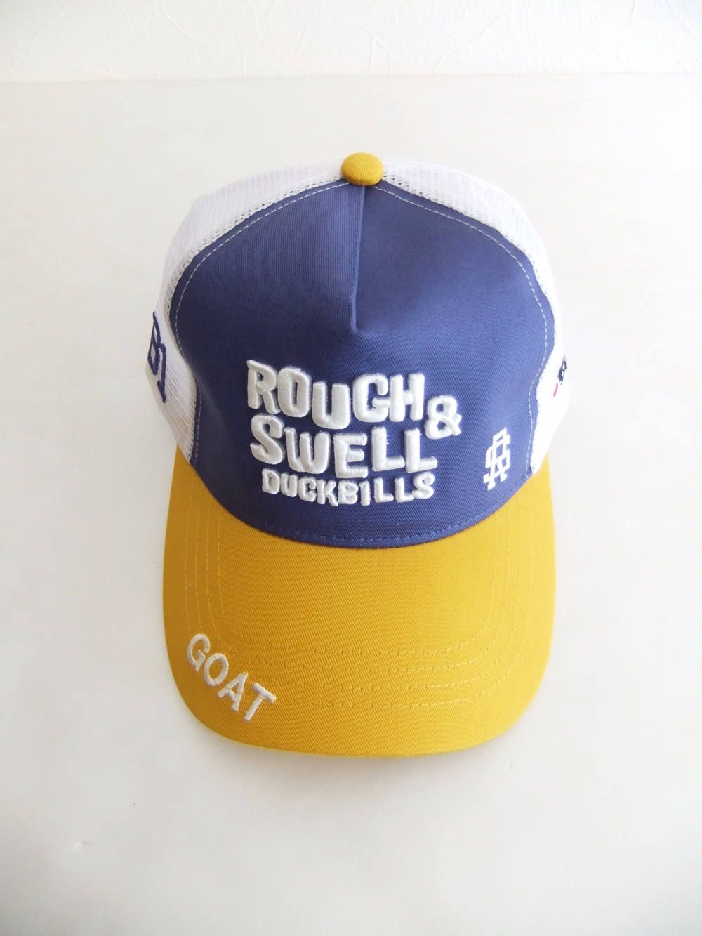 TRUCKER CAP ( パープル × イエロー ) ロゴ入りキャップ