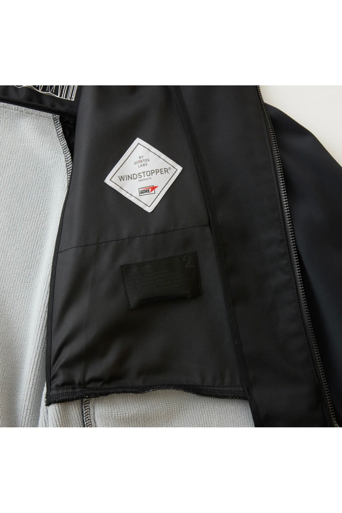 White Mountaineering - 〈BLK〉windstopper jersey jacket -black