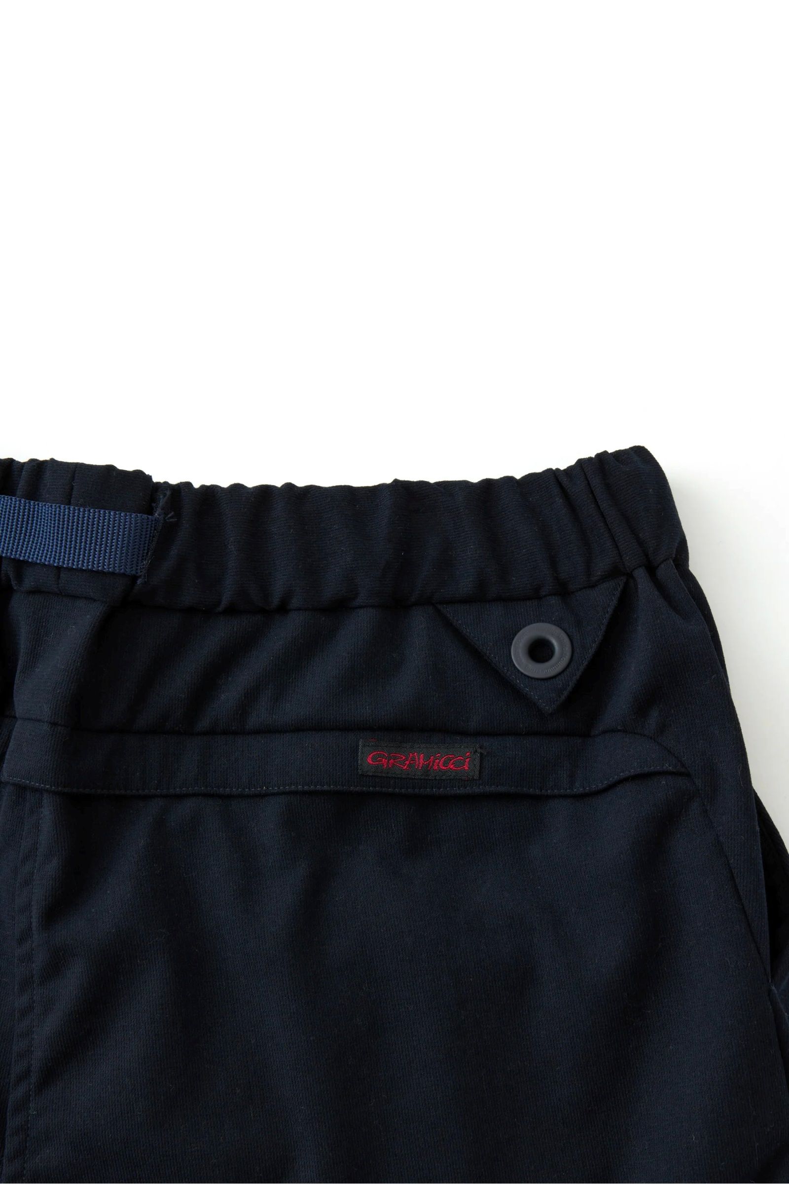 White Mountaineering - wm × Gramicci stretch 3 tuck pants -navy