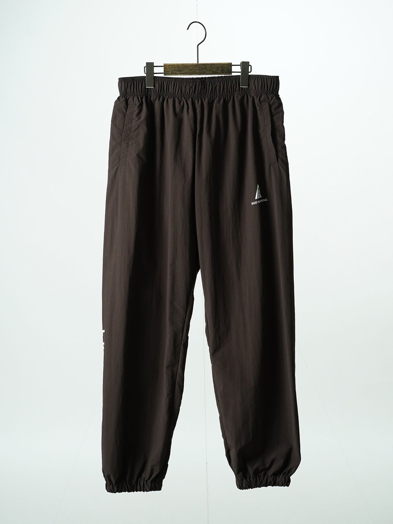 【予約品 7月5日(日) 締切】DAYGLYDE TRACKPANTS / ナイロンパンツ / ダークブラウン
