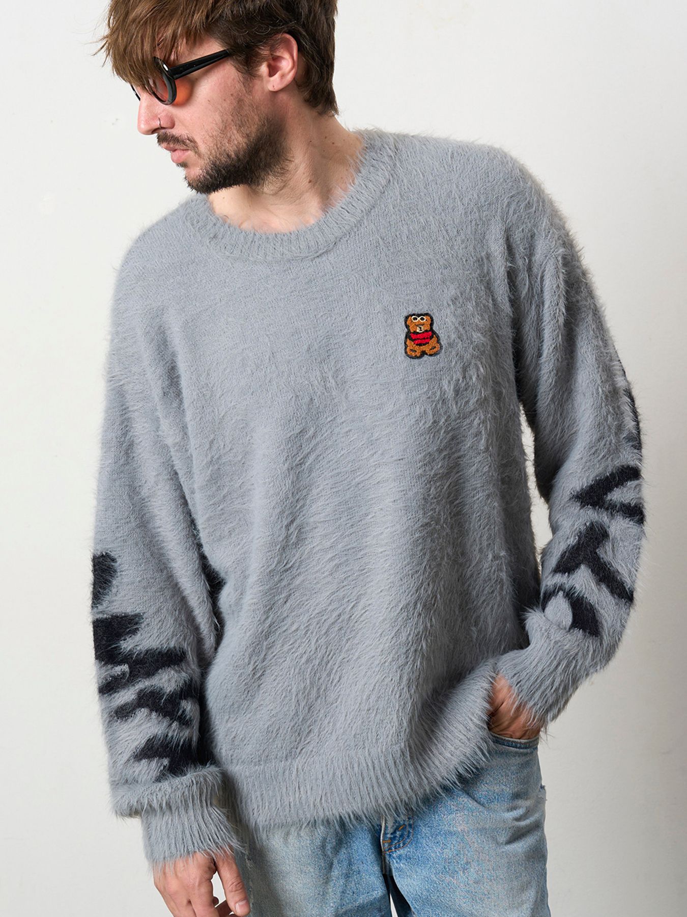 【予約品 5月8日(木) AM10時 締切】 ナイロンフェザーヤーン ビックロゴクロスインターシャシャギープルオーバー / M.グレー