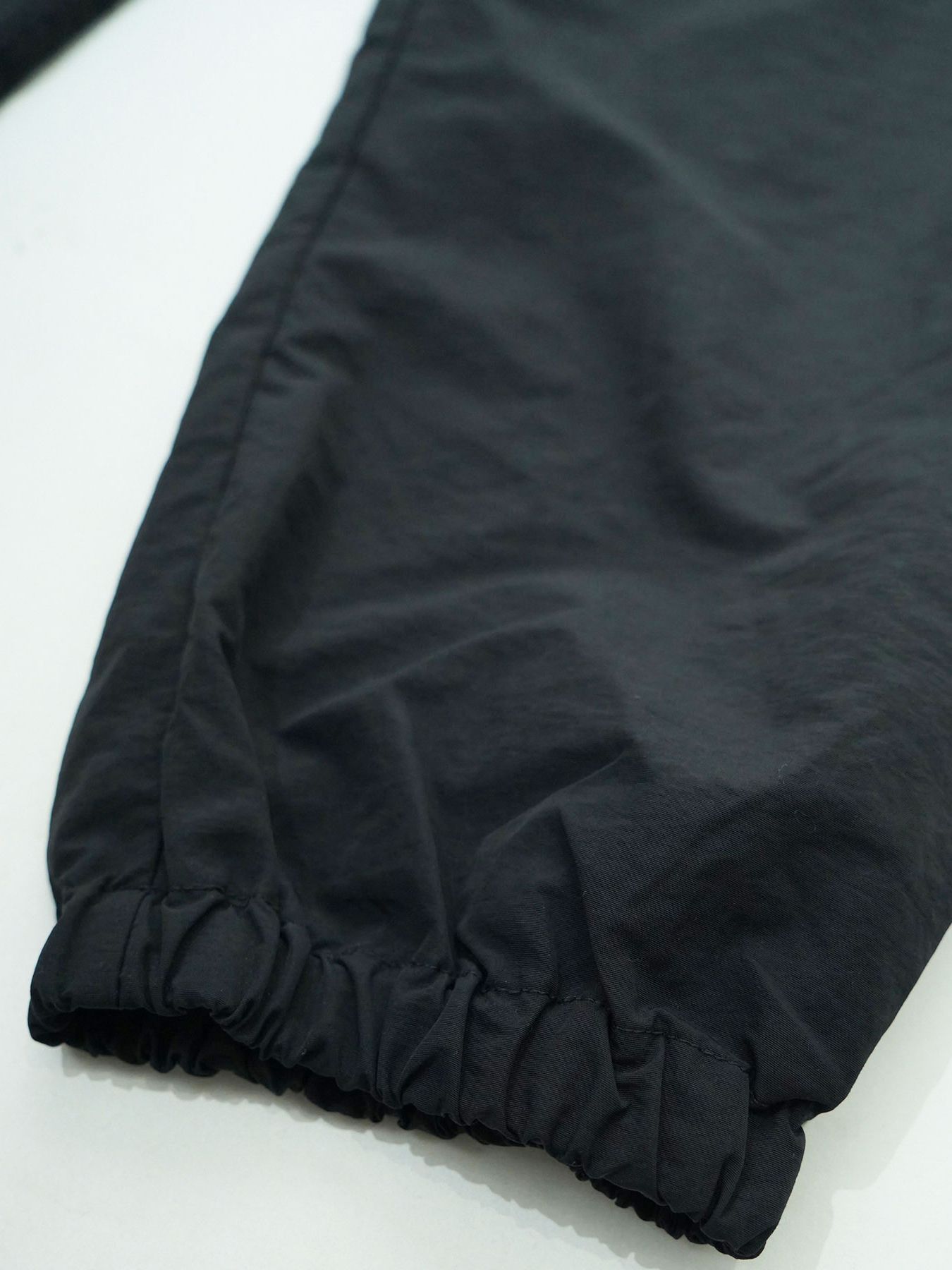 【予約品 7月5日(日) 締切】DAYGLYDE TRACKPANTS / ナイロンパンツ / ブラック