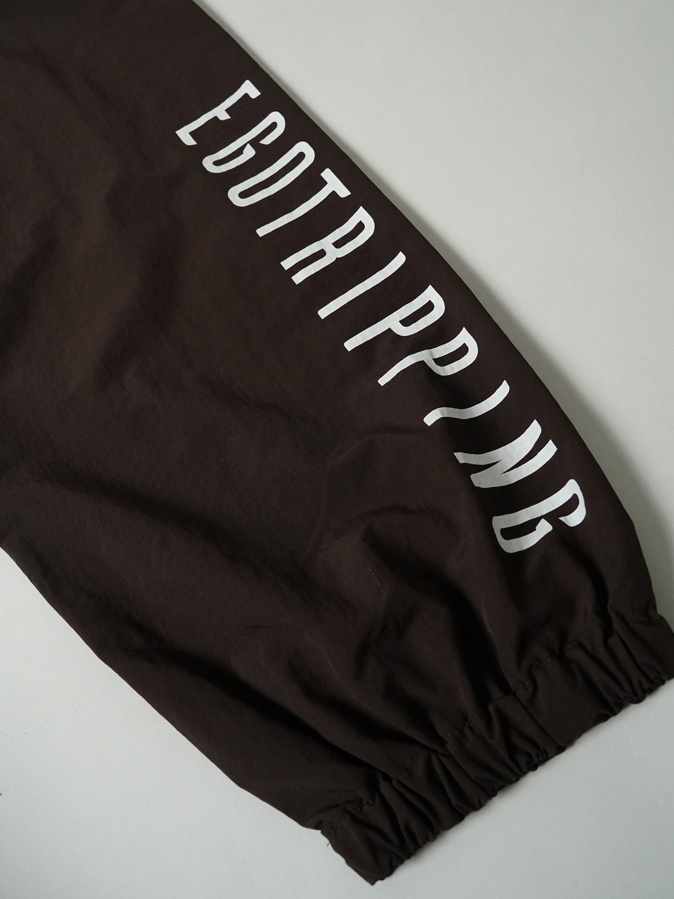 【予約品 7月5日(日) 締切】DAYGLYDE TRACKPANTS / ナイロンパンツ / ダークブラウン