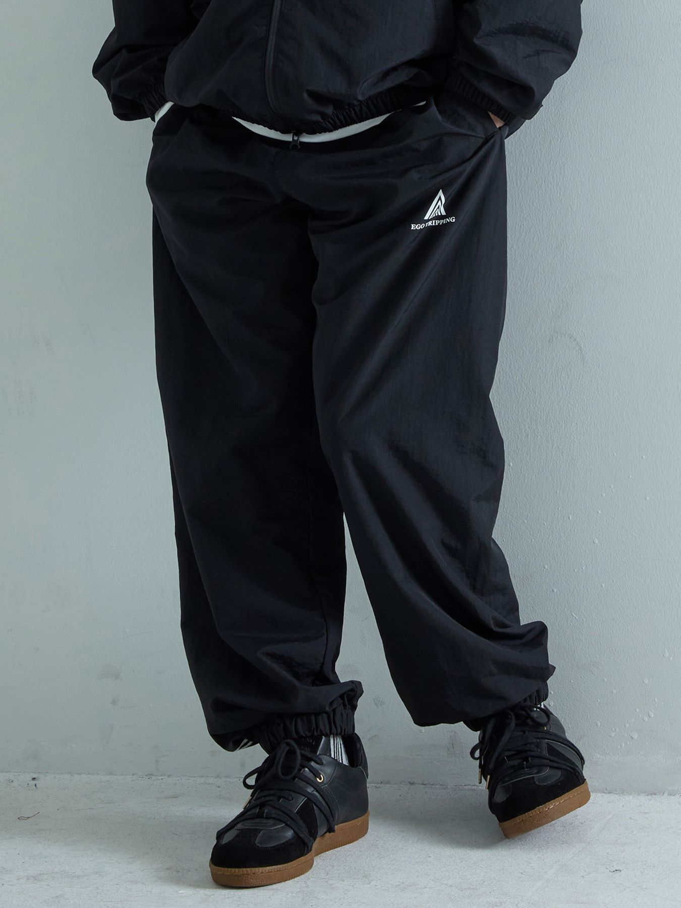 【予約品 7月5日(日) 締切】DAYGLYDE TRACKPANTS / ナイロンパンツ / ブラック