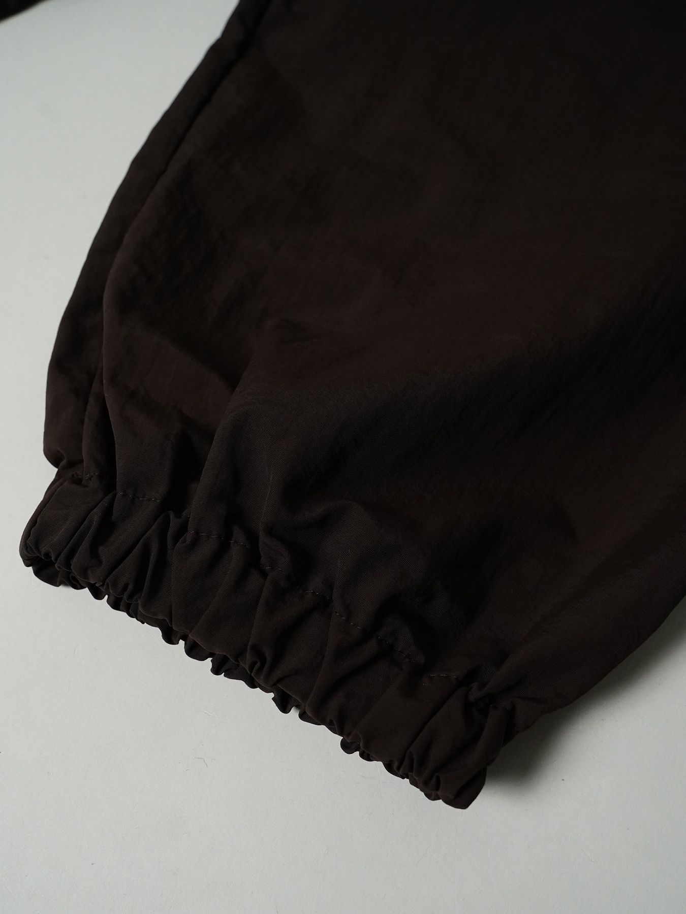 【予約品 7月5日(日) 締切】DAYGLYDE TRACKPANTS / ナイロンパンツ / ダークブラウン