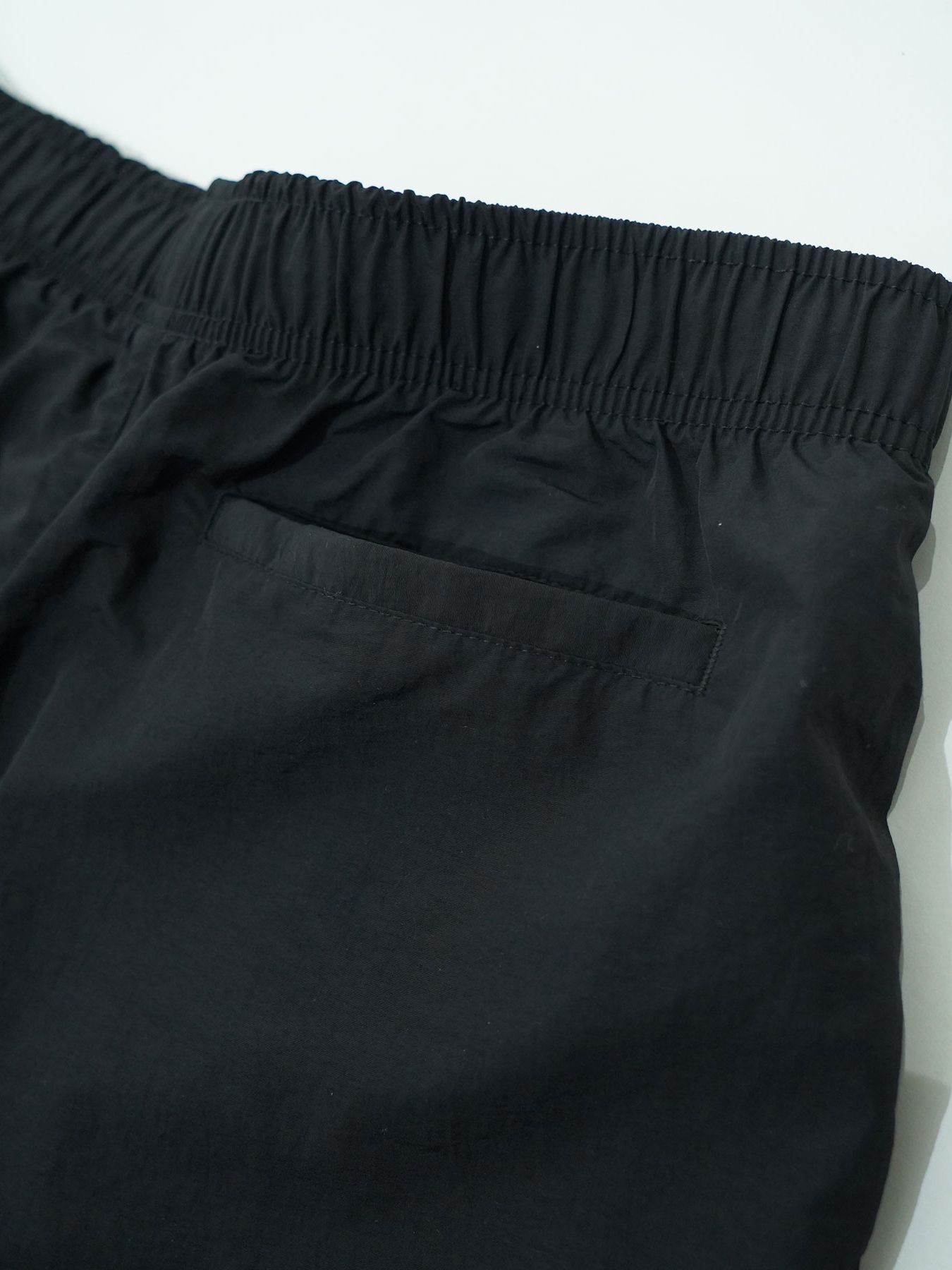 【予約品 7月5日(日) 締切】DAYGLYDE TRACKPANTS / ナイロンパンツ / ブラック
