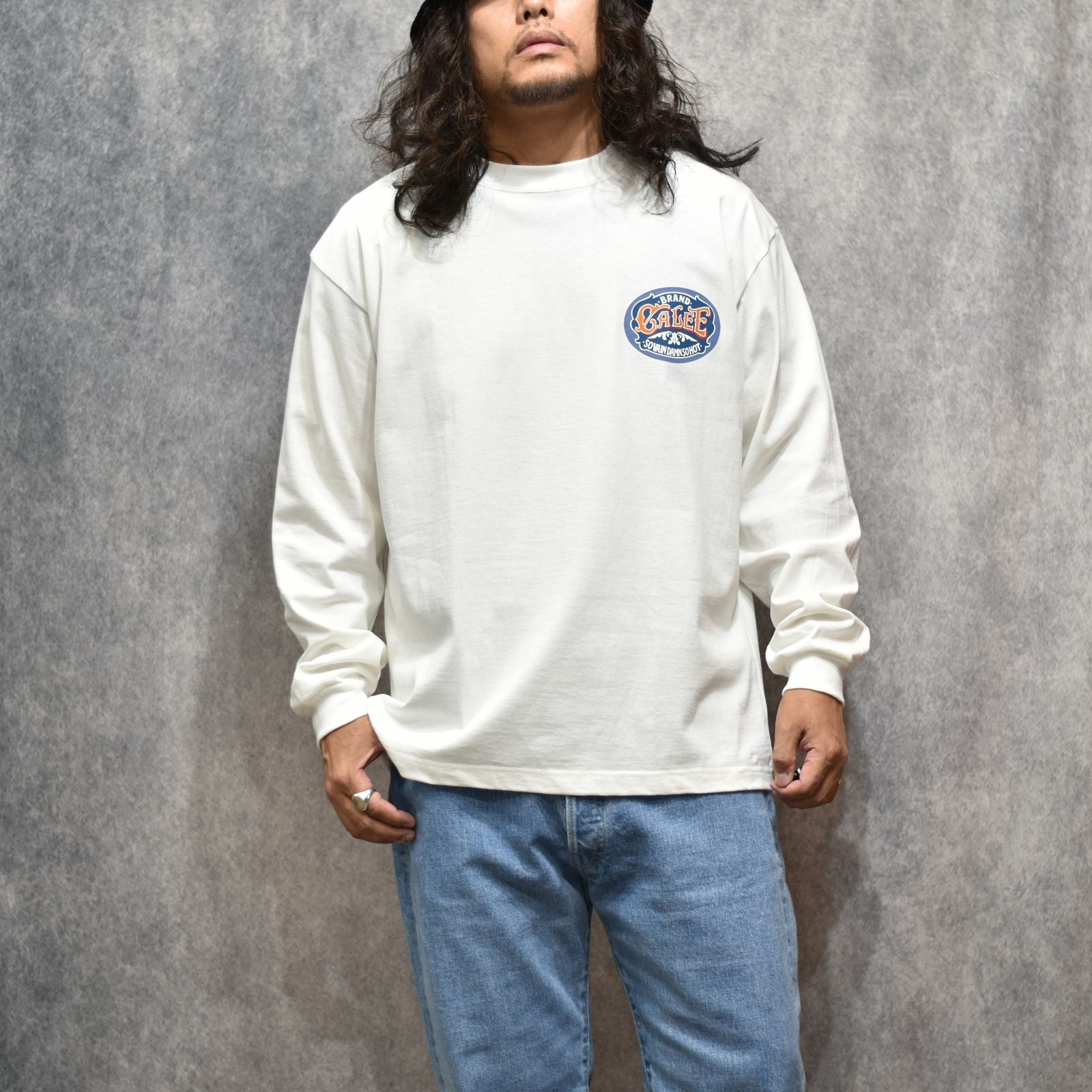 VINTAGE TYPE SIGNBOARD L/S TEE ＜NATURALLY PAINT DESIGN＞ (WHITE)｜プリントTシャツ｜CL-26AWNT002