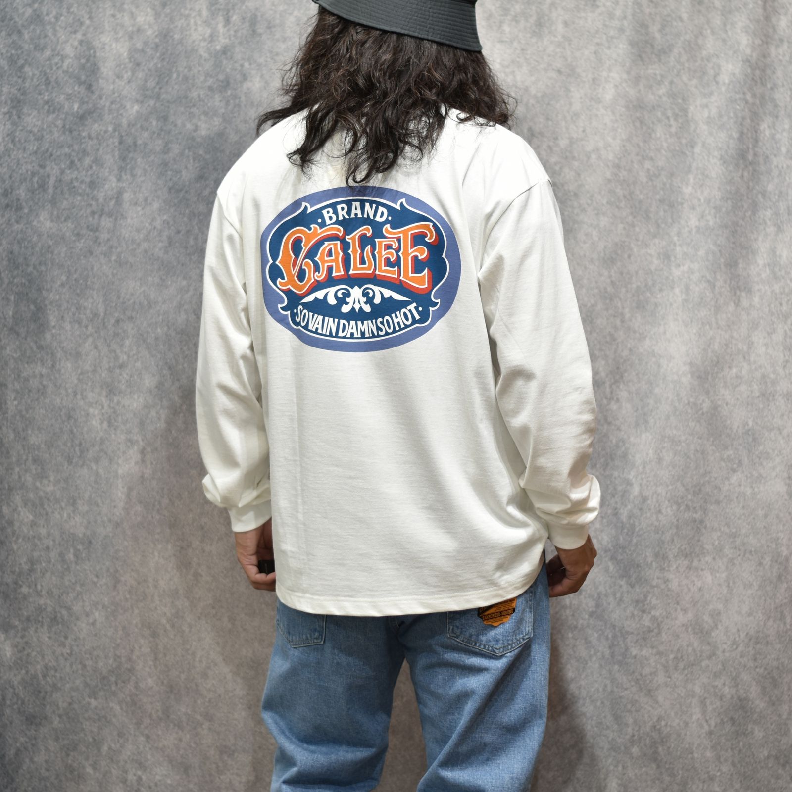 VINTAGE TYPE SIGNBOARD L/S TEE ＜NATURALLY PAINT DESIGN＞ (WHITE)｜プリントTシャツ｜CL-26AWNT002