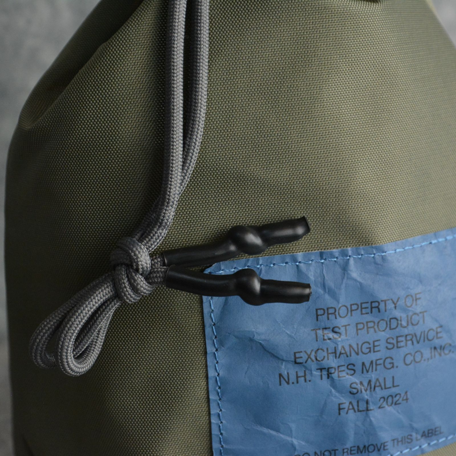 × OUTDOOR PRODUCTS DRAWSTRING BAG （KHAKI） / ナイロン バッグ （カーキ）