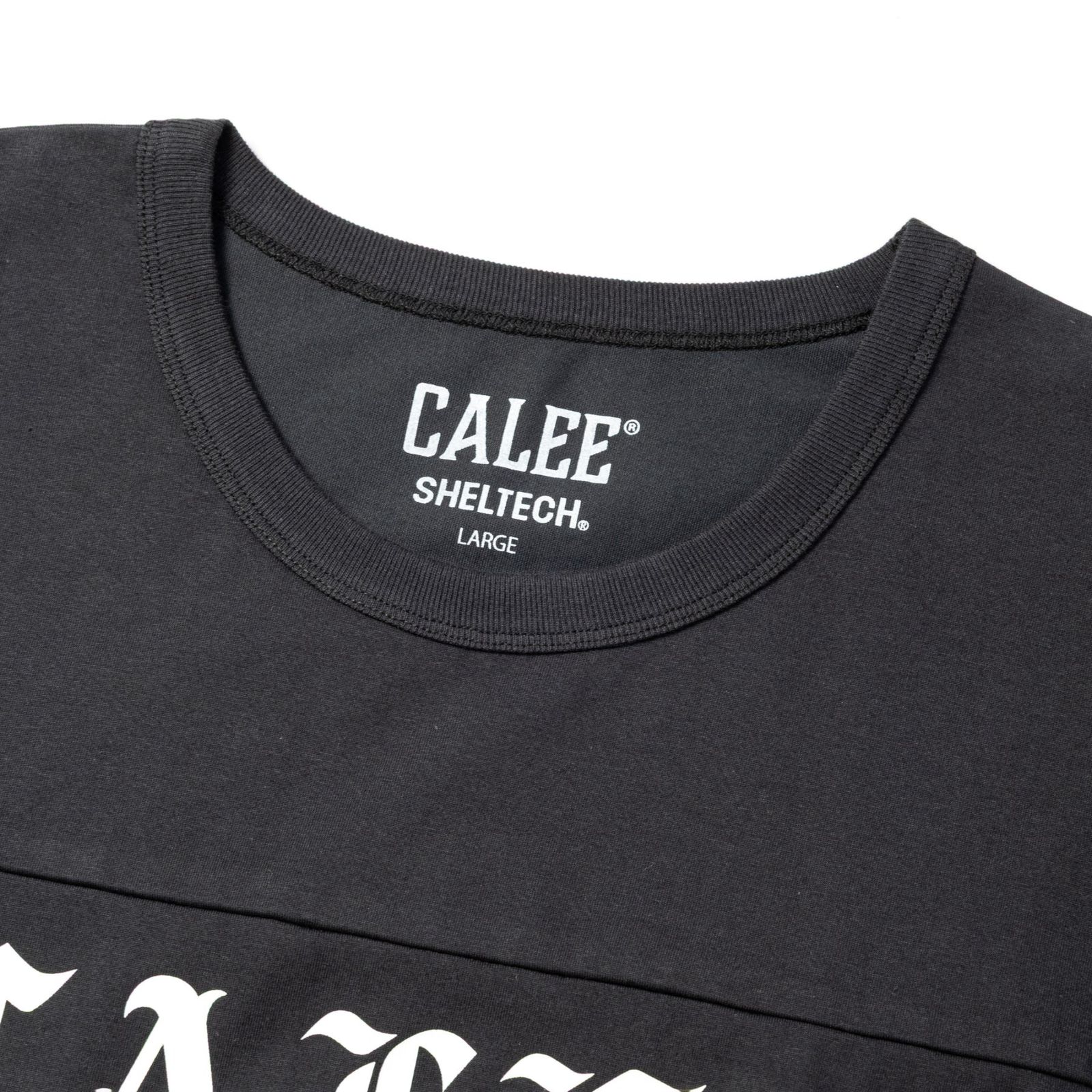 ×SHELTECH®︎ LOGO FOOT BALL TEE ＜B TYPE＞ (BLACK)｜シェルテック キャリー ロゴ フットボールTシャツ｜CL-SHELTECH006