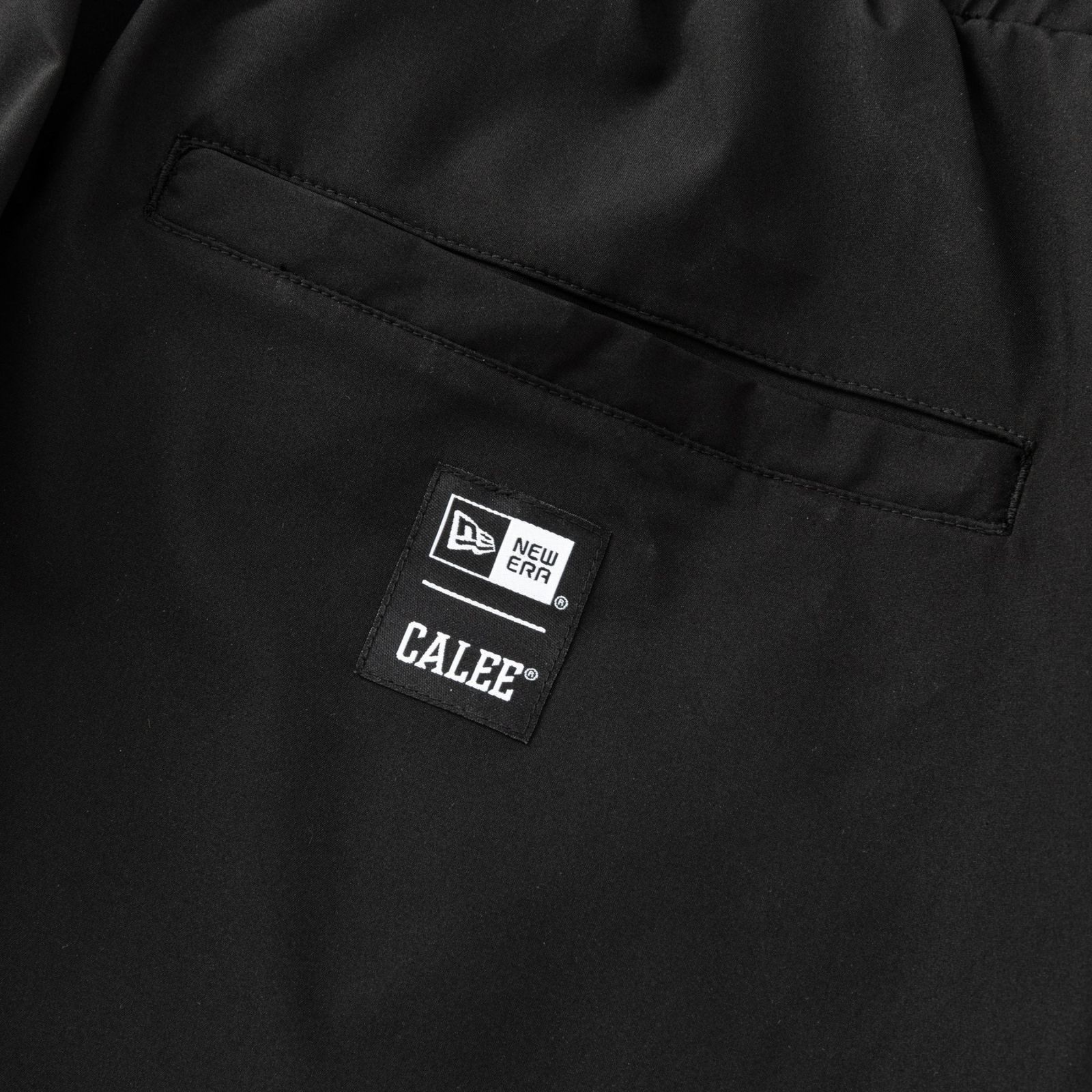 × NEWERA®︎ CALEE LOGO OVERSIZED PIPING TRACK PANTS ＜EXCLUSIVE＞ (BLACK) / ニューエラ トラックパンツ