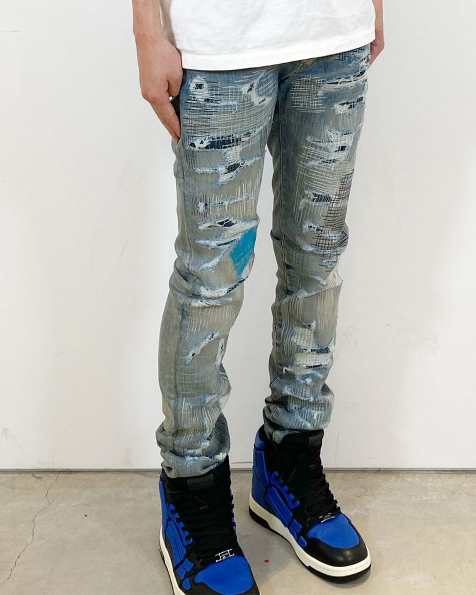 AMIRI ALL OVER REPAIR JEAN INDIGO