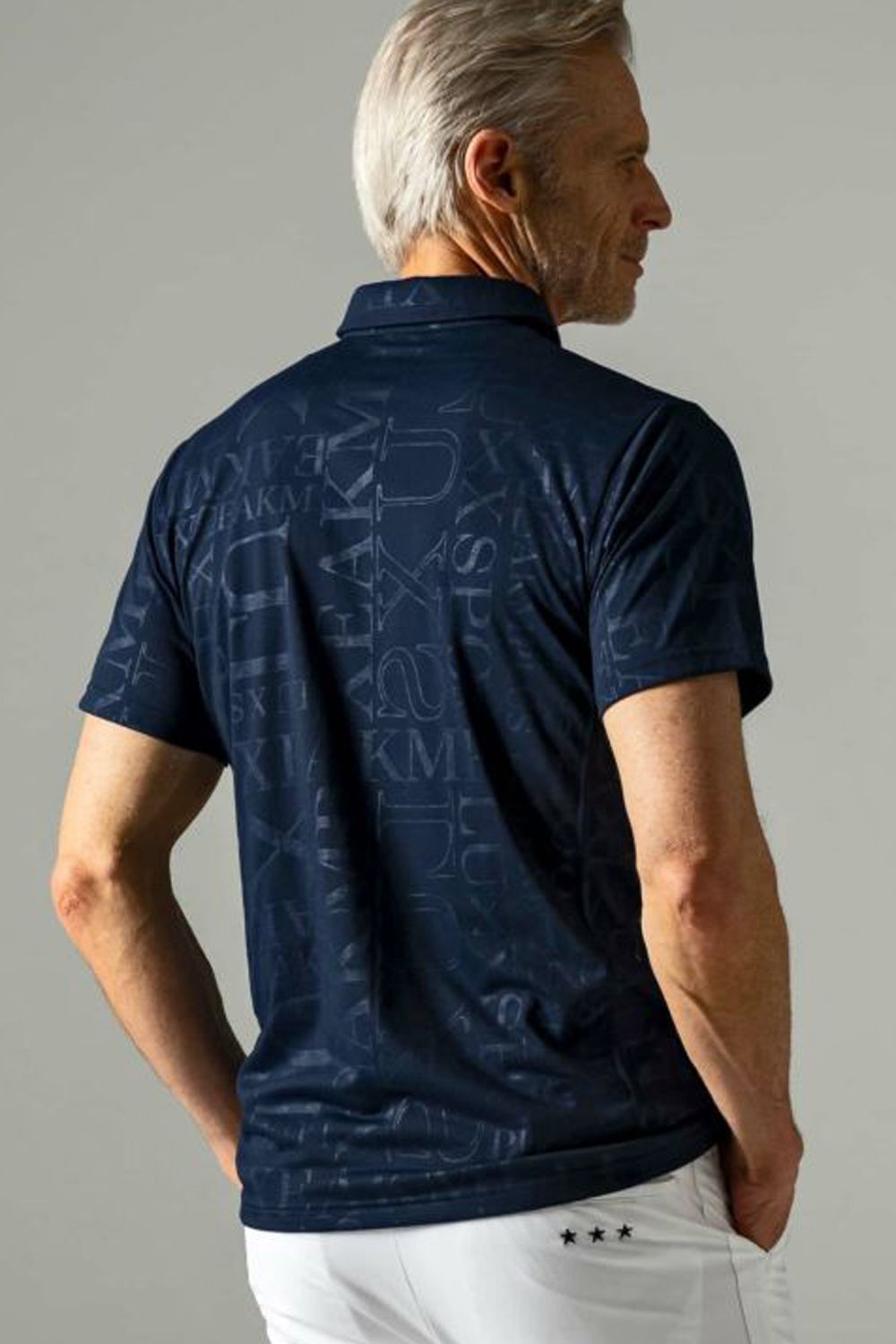 EMBOSSED PRINT POLO SHIRTS / ロゴパターン 半袖ポロシャツ ネイビー
