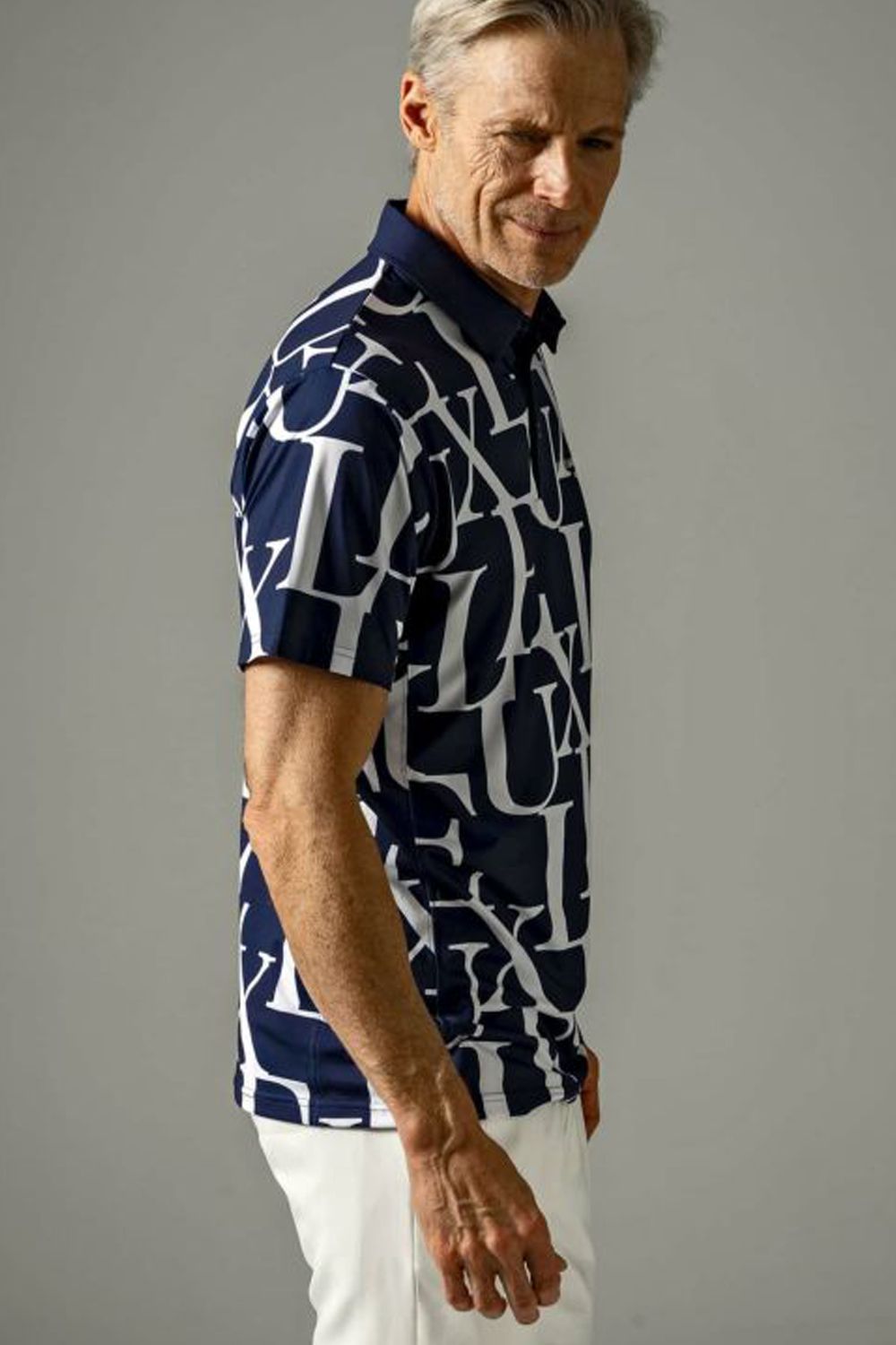 LUXE PATTERN POLO SHIRTS / 総柄ロゴ 半袖ポロシャツ ネイビー