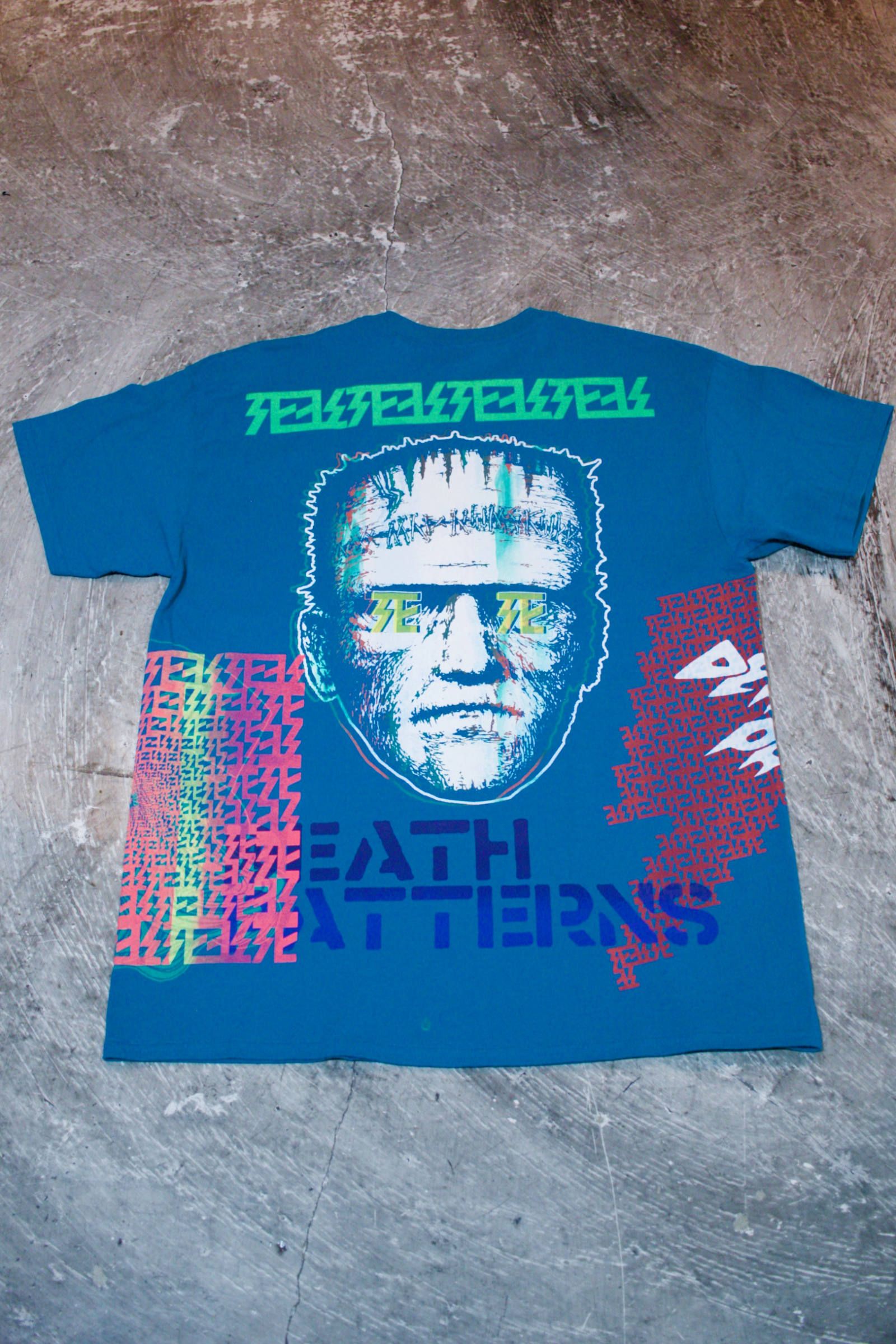 デスパターンズ2020 "NO MAD NUMSKULL" マルチプリントTEE BLU/Lサイズ