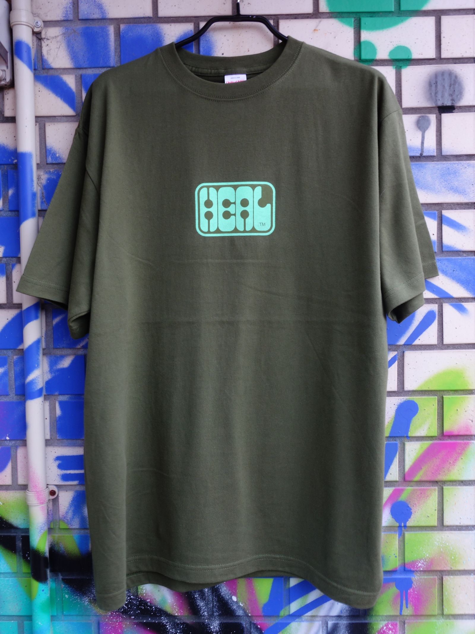 HEAL × メタルラスタ会議 /  Tシャツ シティグリーン