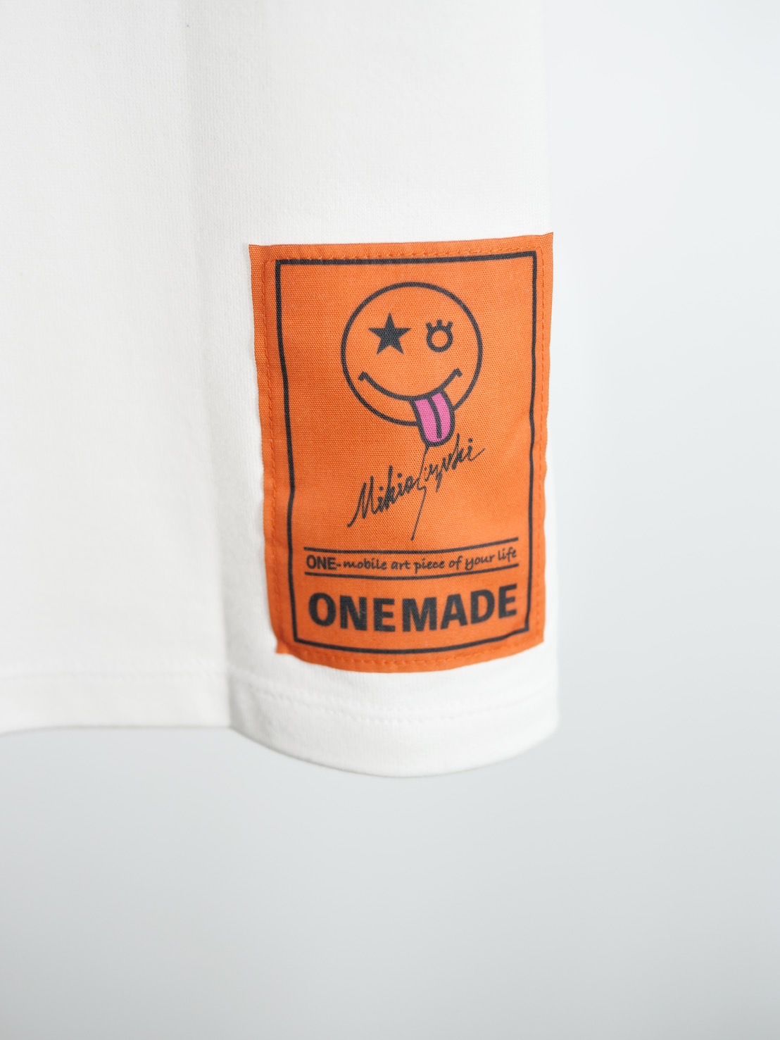 ONE MADE - 【ニコちゃんTシャツ】現代アート作家が手がけるブランド ...