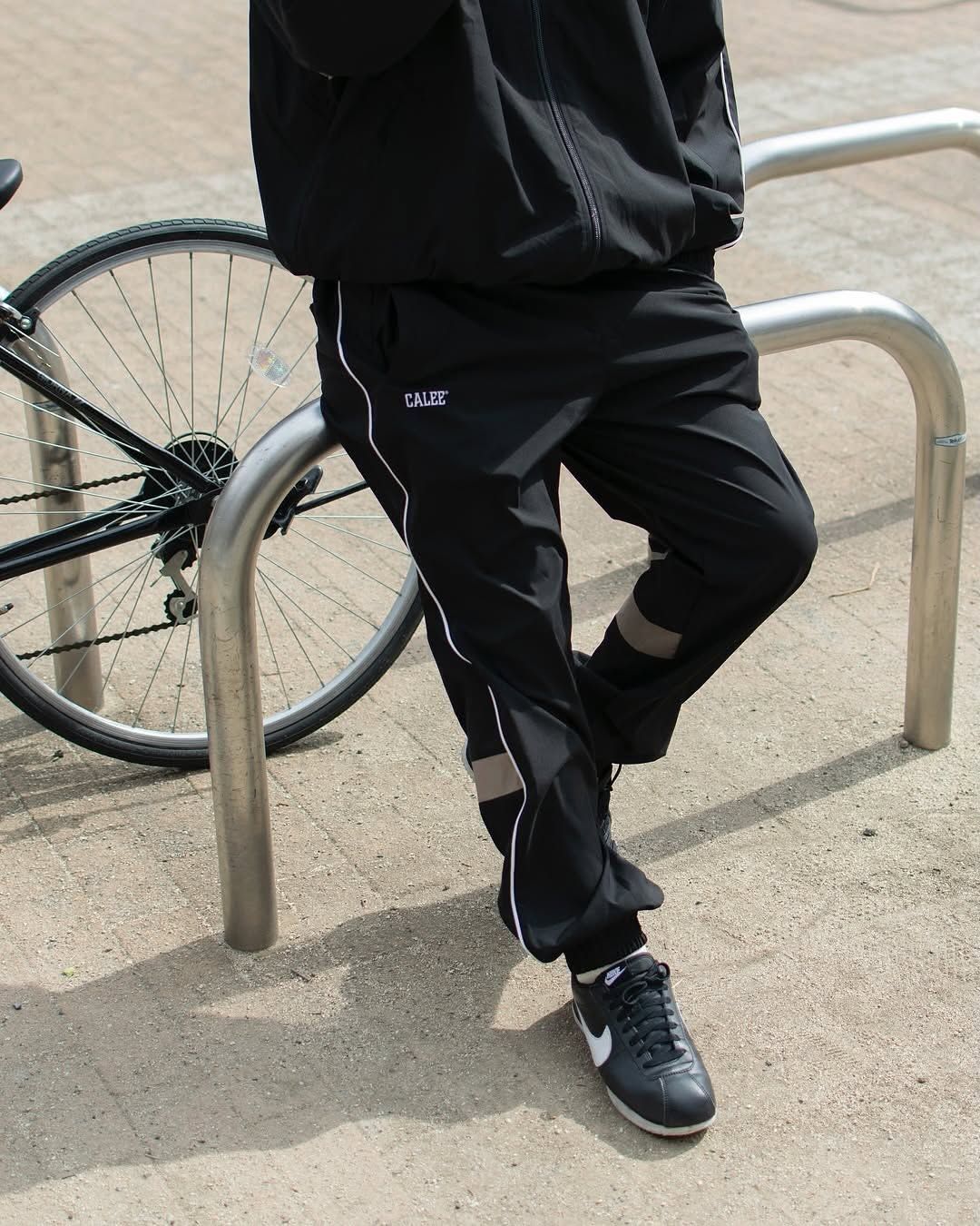 ×NEWERA®︎ CALEE LOGO OVERSIZED PIPING TRACK PANTS (BLACK) / ニューエラ コラボ トラック パンツ / セットアップ可能