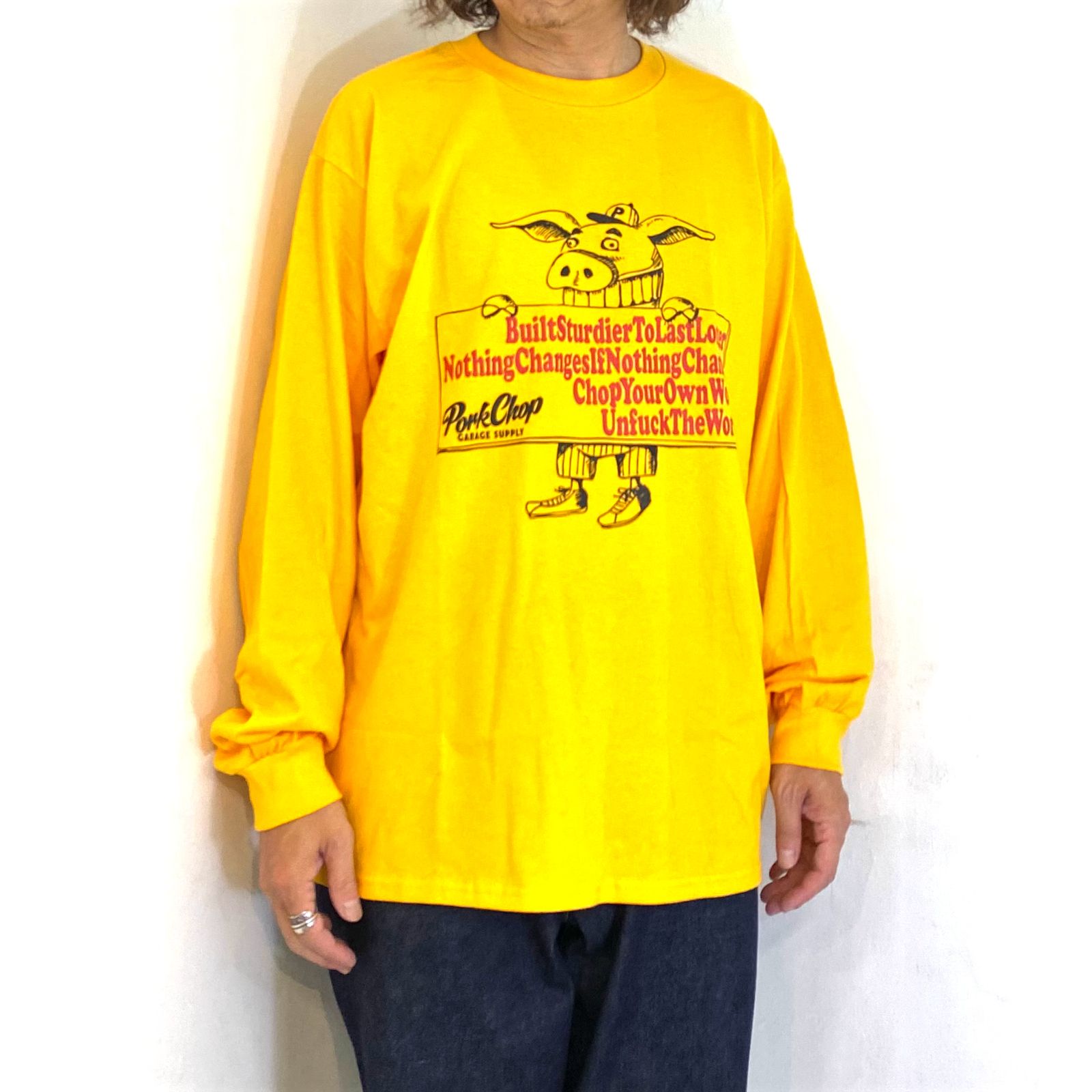 SLOGAN L/S TEE (GOLD) / スローガン ロングスリーブ Tシャツ
