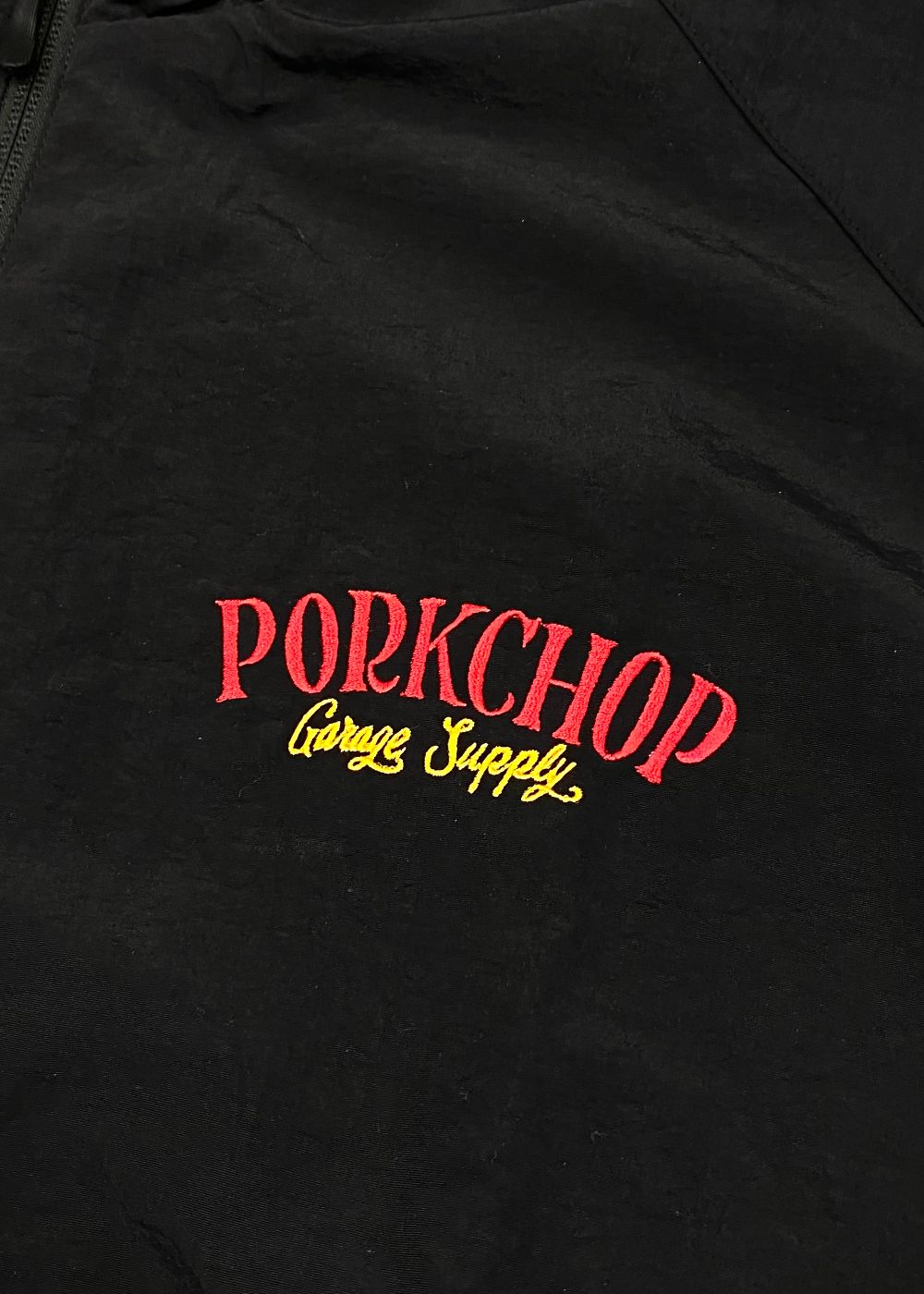 PORK BACK NYLON JKT (BLACK) / ポークバック ナイロン トラック ジャケット