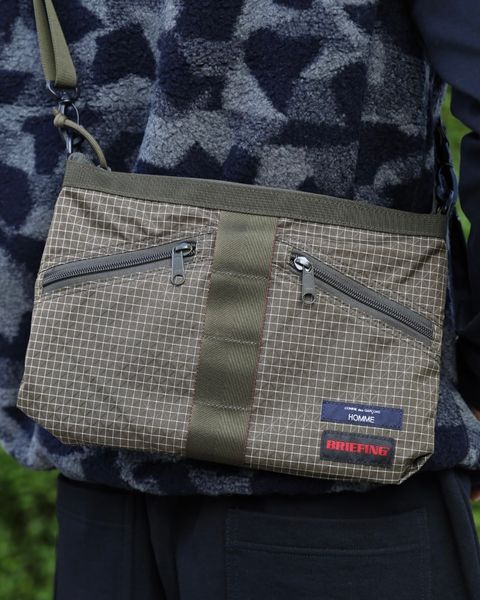COMME des GARCONS HOMME BRIEFING W-NAME REVERSIBLE SACOCHE x ウールボアフリースベスト