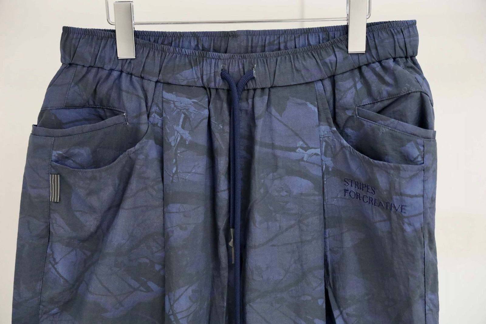 S.F.C 25FW エスエフシー WIDE TAPERED EASY PANTS (REAL TREE CAMO)  (SFCFW25P03)Navy Tree Camo