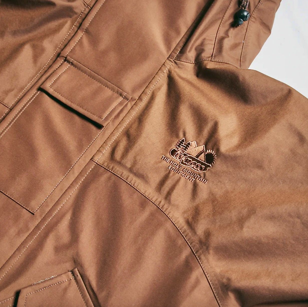 イズネス23AW NINJA HOODIE SHELL JACKET(1005AWJK02)BROWN