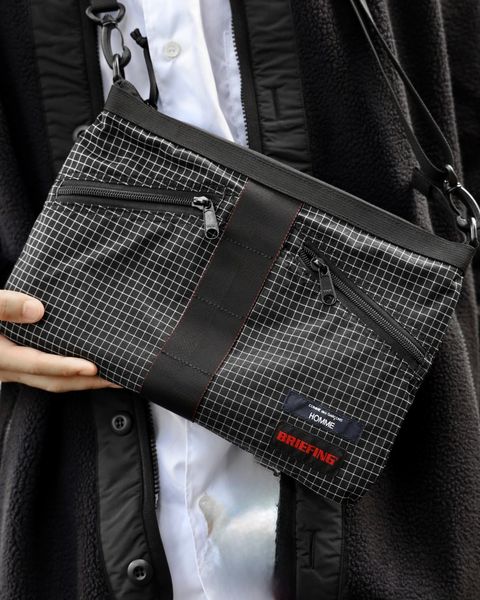 COMME des GARCONS HOMME BRIEFING W-NAME REVERSIBLE SACOCHE x エステルボアライナーカーディガン