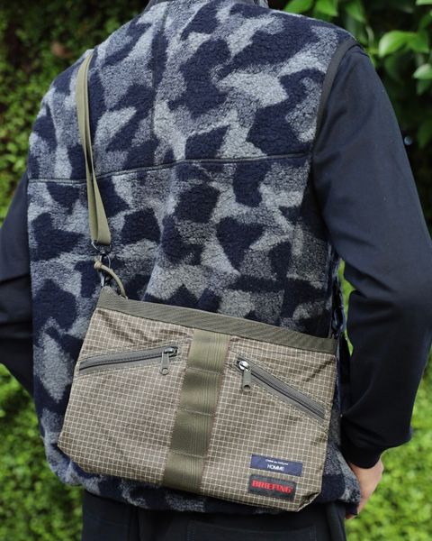 COMME des GARCONS HOMME BRIEFING W-NAME REVERSIBLE SACOCHE x ウールボアフリースベスト