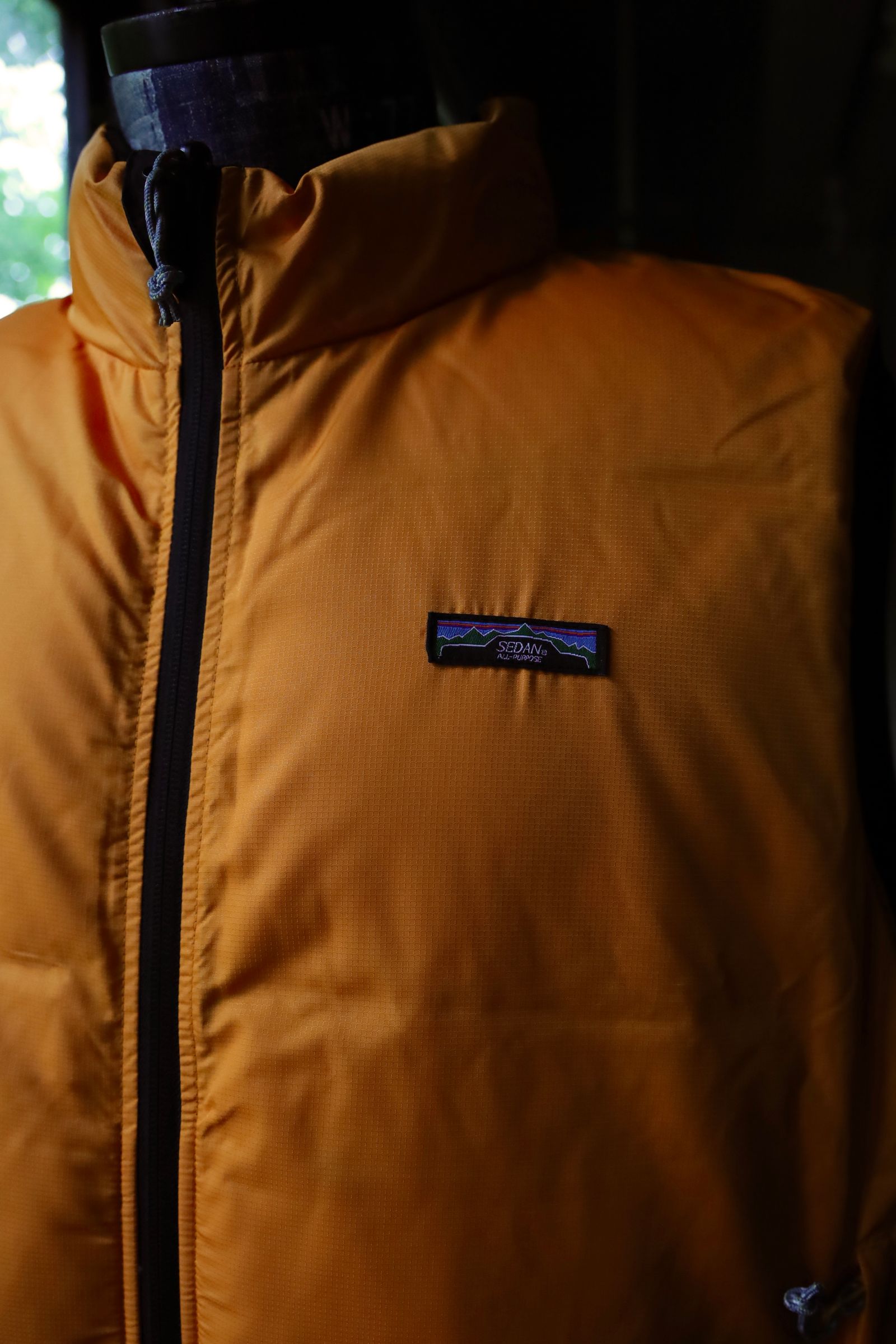セダンオールパーパス FW24 Reversible Down Vest(SD24F-JK02) Black × Mango☆10月26日(土)発売！