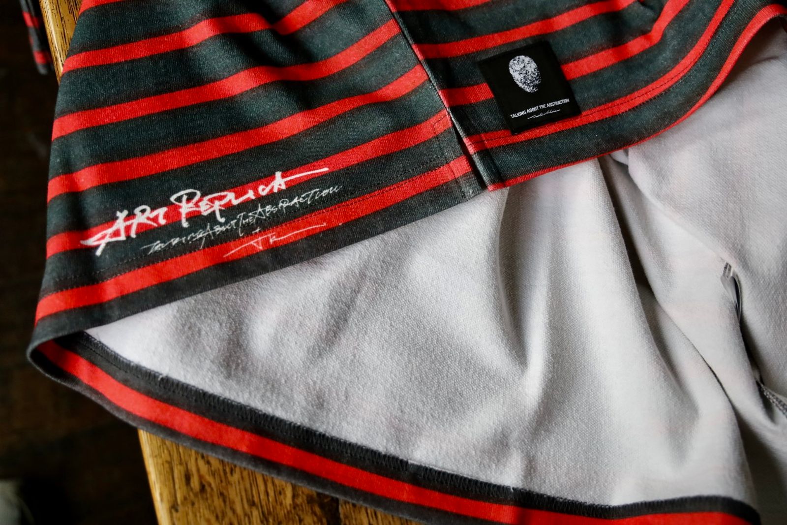トーキングアバウト ジ アブストラクション 25SS "ROF"ART REPLICA MOCK NECK(NPT-NSP-001)