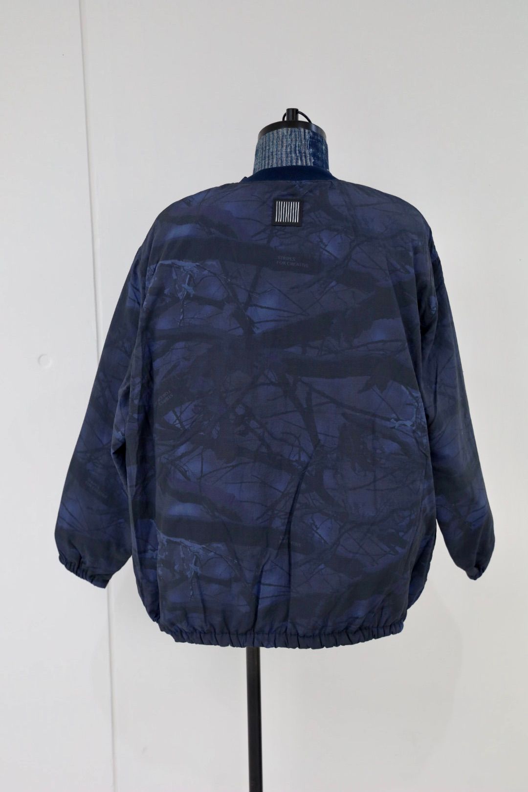 S.F.C 25FW エスエフシー BASEBALL HALF ZIP JACKET (SFCFW25J03)Navy Tree Camo