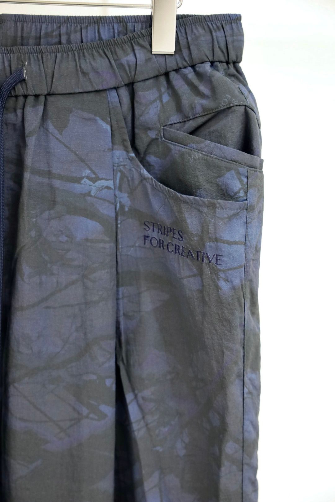 S.F.C 25FW エスエフシー WIDE TAPERED EASY PANTS (REAL TREE CAMO)  (SFCFW25P03)Navy Tree Camo