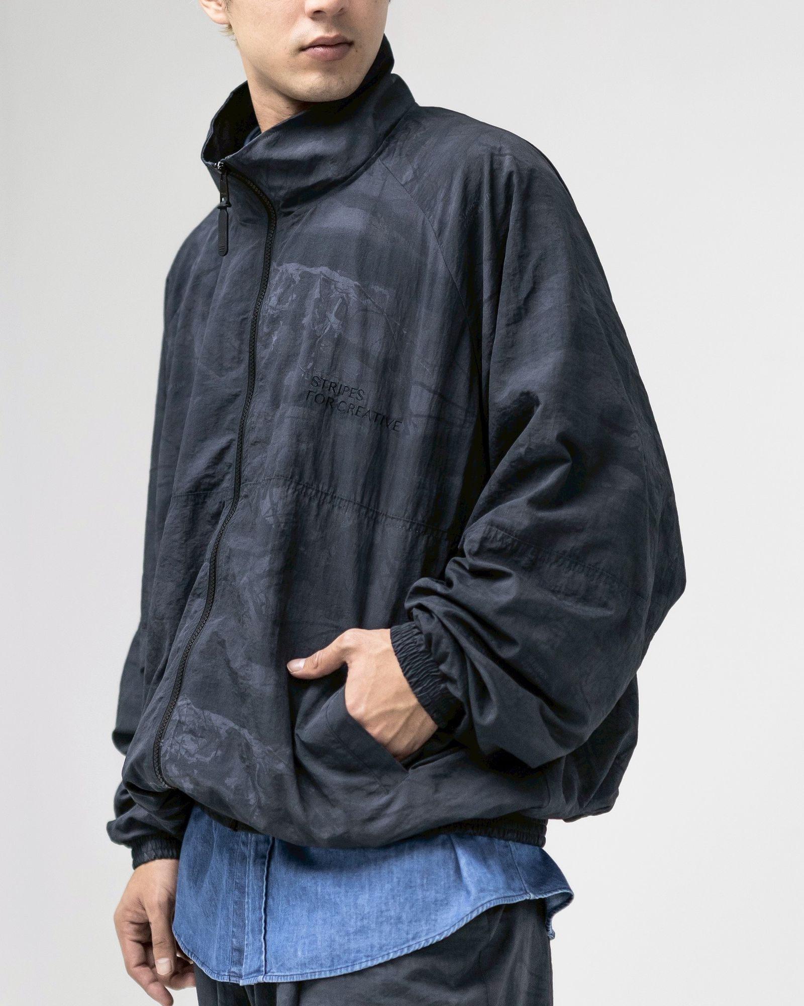 S.F.C-Stripes For Creative- WINDBREAKER JACKET (REAL TREE CAMO)  MARK スタイル