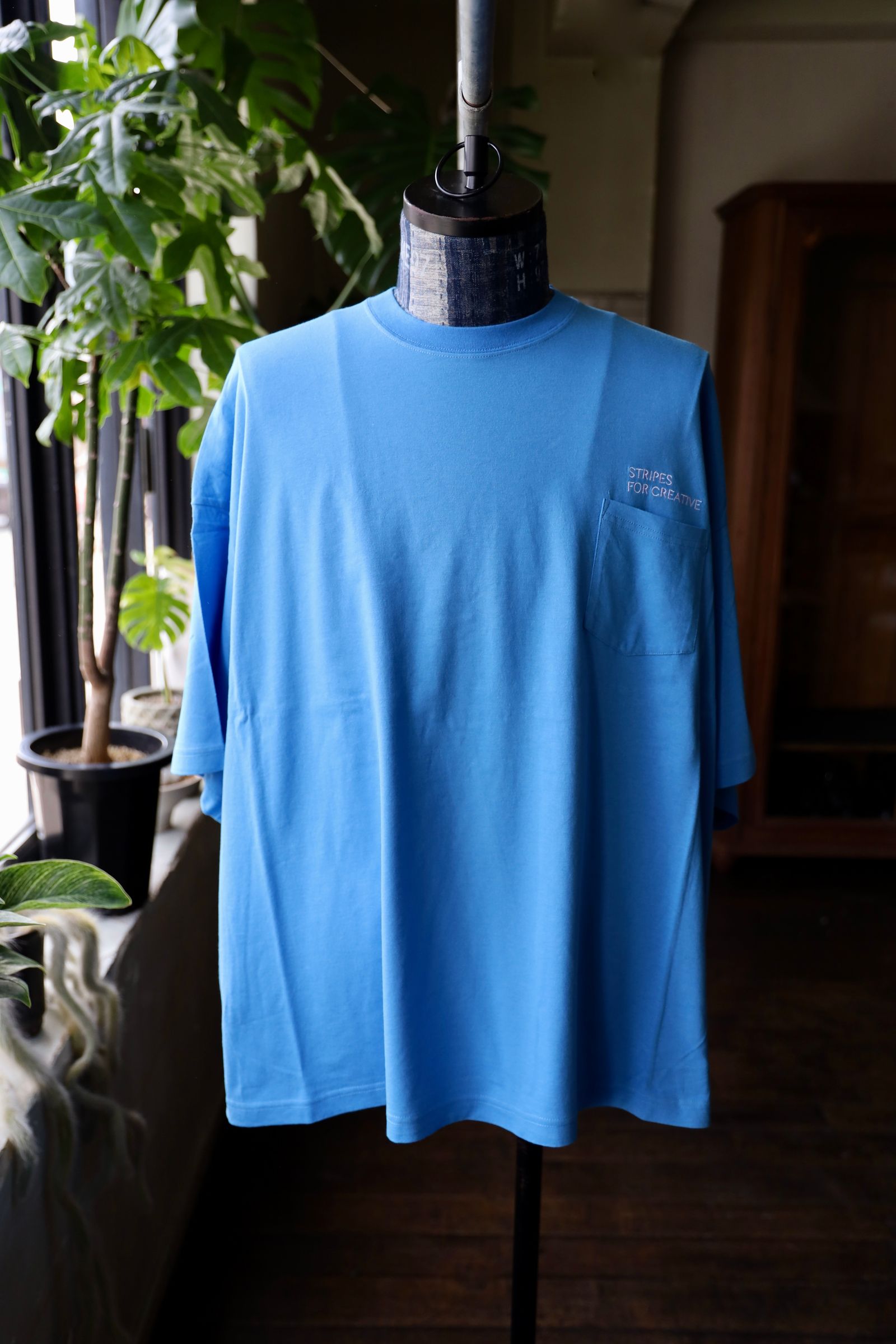 S.F.C 25SS エスエフシー SUPER BIG FLAT POCKET TEE(SFCSS25CS16)BLUE