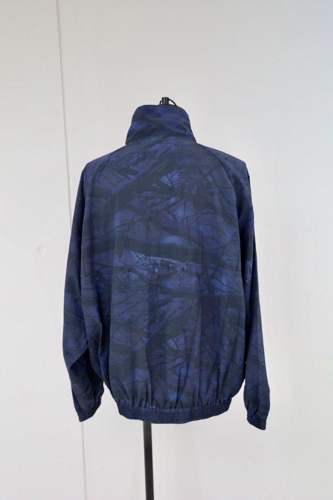 S.F.C 25FW エスエフシー WINDBREAKER JACKET (REAL TREE CAMO) (SFCFW25J06)Navy Tree Camo