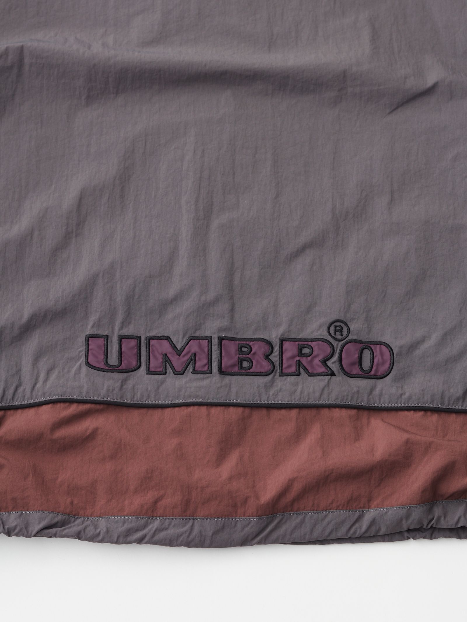 セダンオールパーパス SS24 UMBRO® Woven Track Jacket(SD24S-JK05)Charcoal Brown☆3月9日(土)発売！