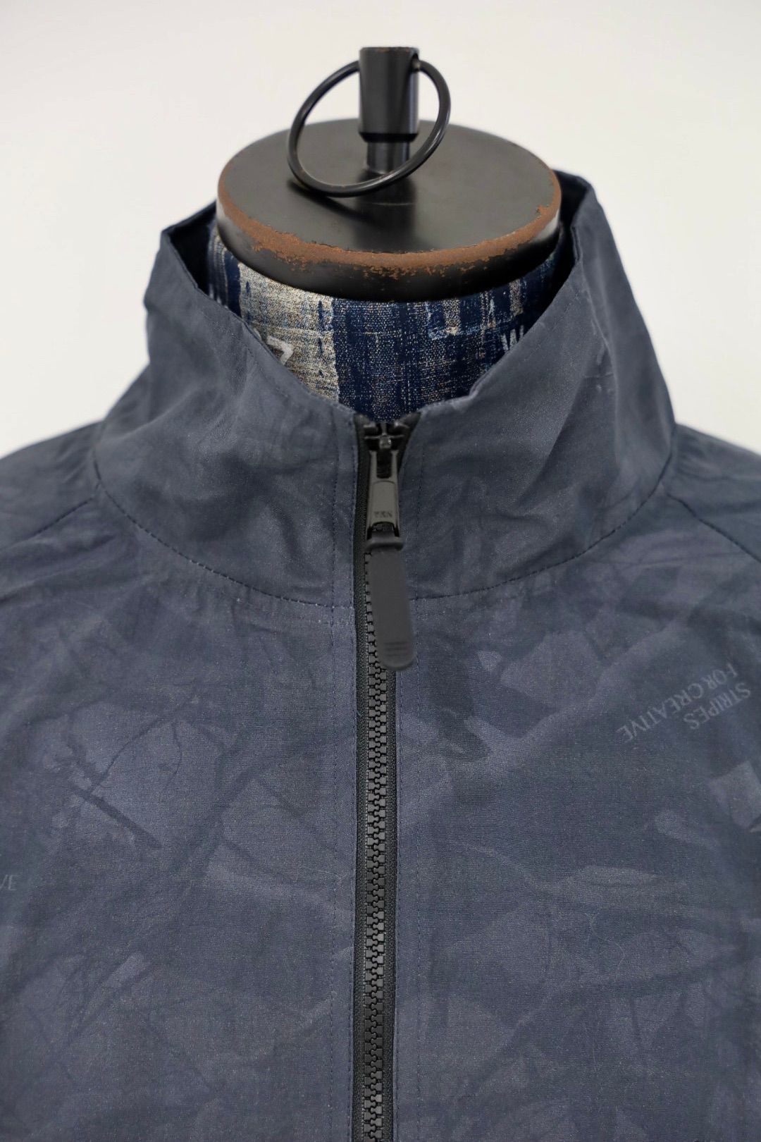 S.F.C 25FW エスエフシー WINDBREAKER JACKET (REAL TREE CAMO) (SFCFW25J06)Black Tree Camo