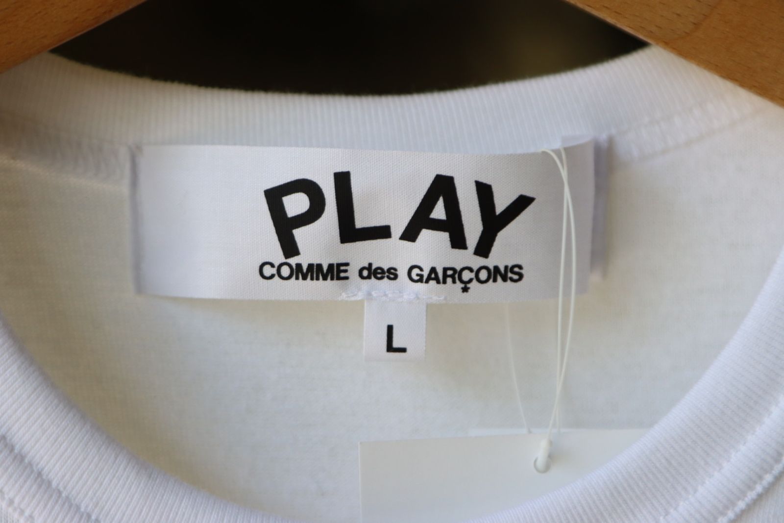 Comme des garcons outlet play tag