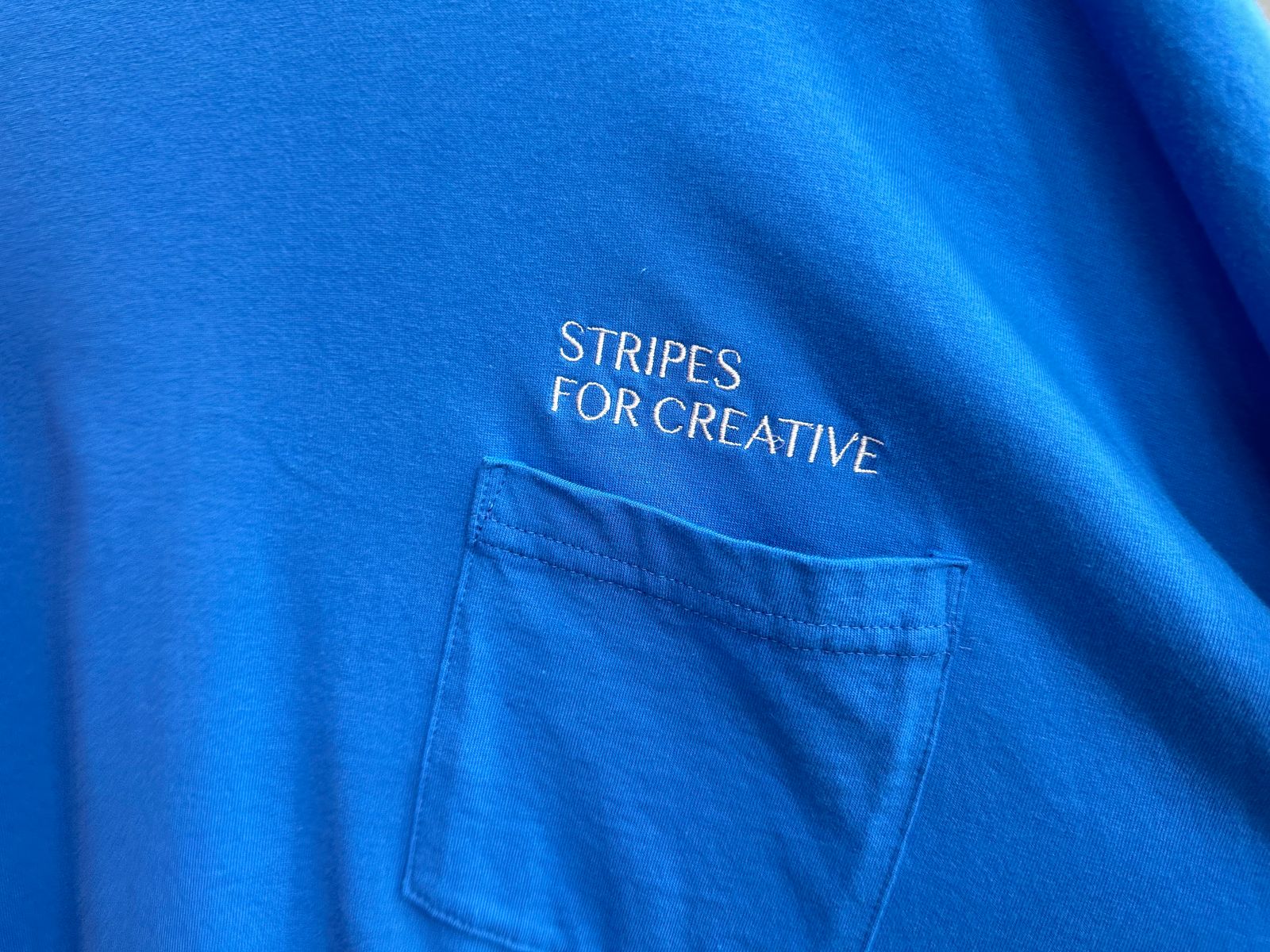 S.F.C 25SS エスエフシー SUPER BIG FLAT POCKET TEE(SFCSS25CS16)BLUE