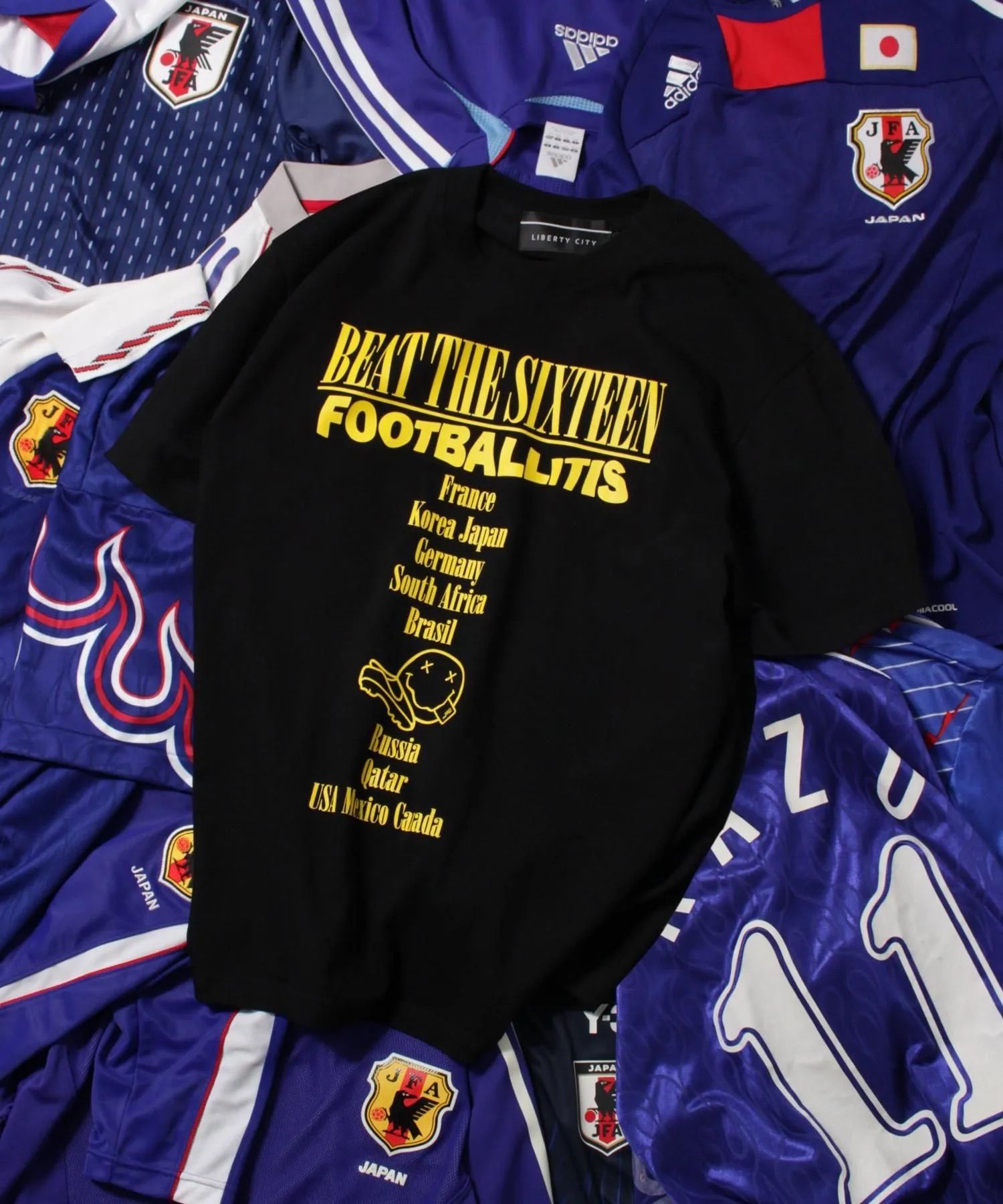 【FOOTBALLITIS】[SMILEY] Tシャツ / BLACK [261321NV]