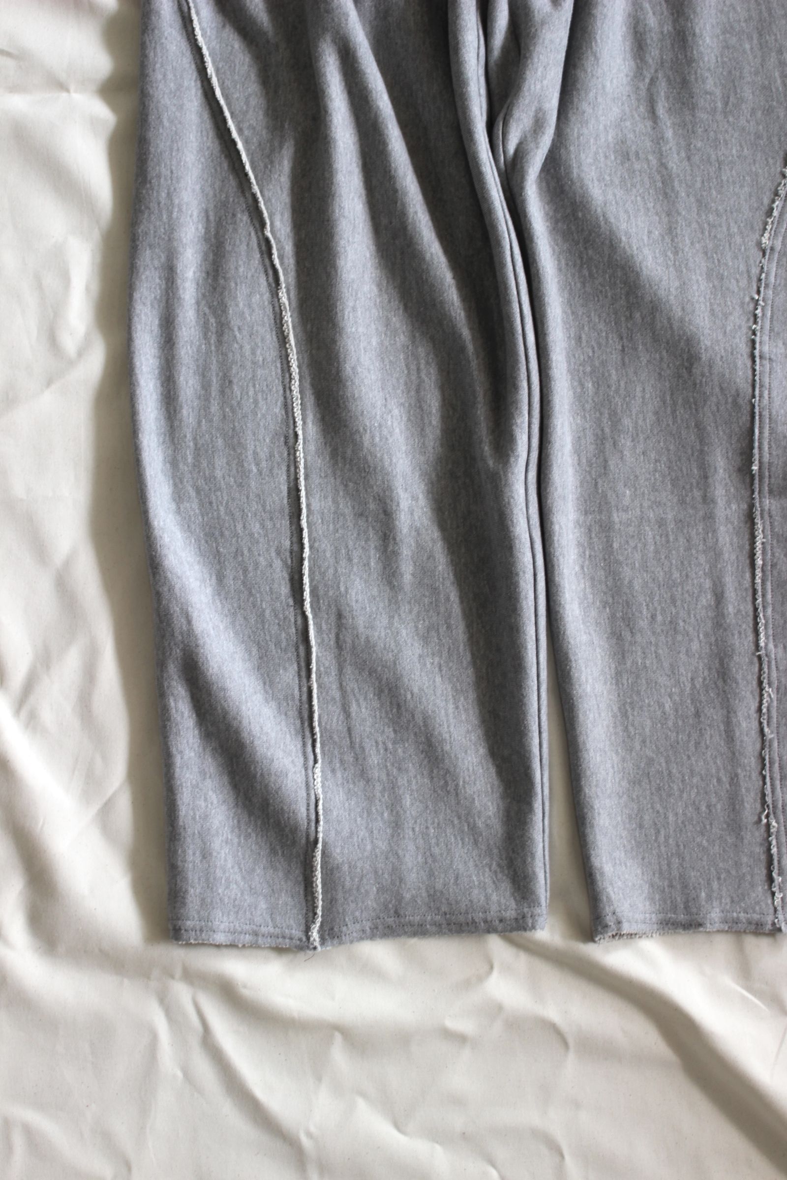 HAKEEM TWIST TROUSERS | HEATHER GRAY | スウェットパンツ