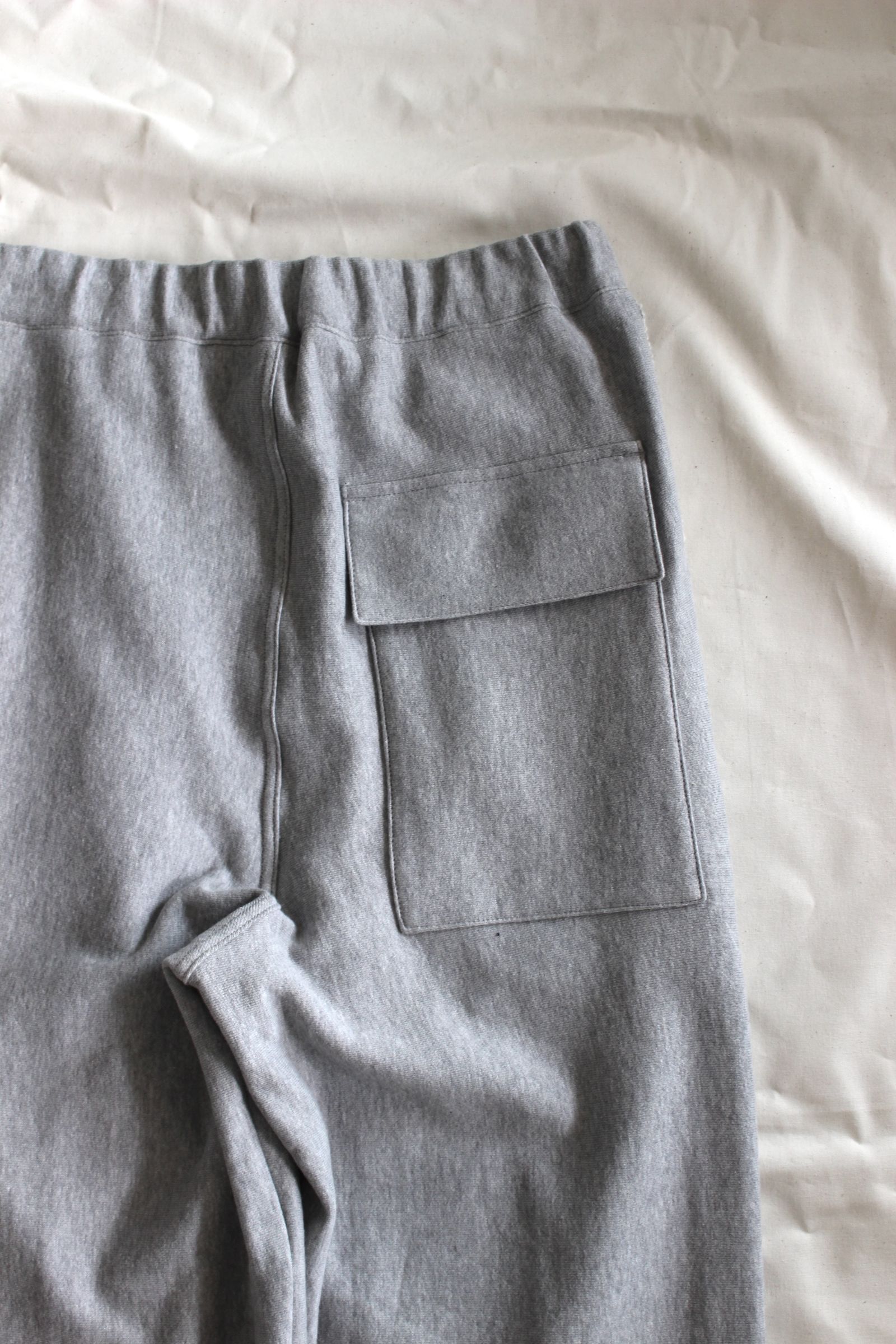 HAKEEM TWIST TROUSERS | HEATHER GRAY | スウェットパンツ