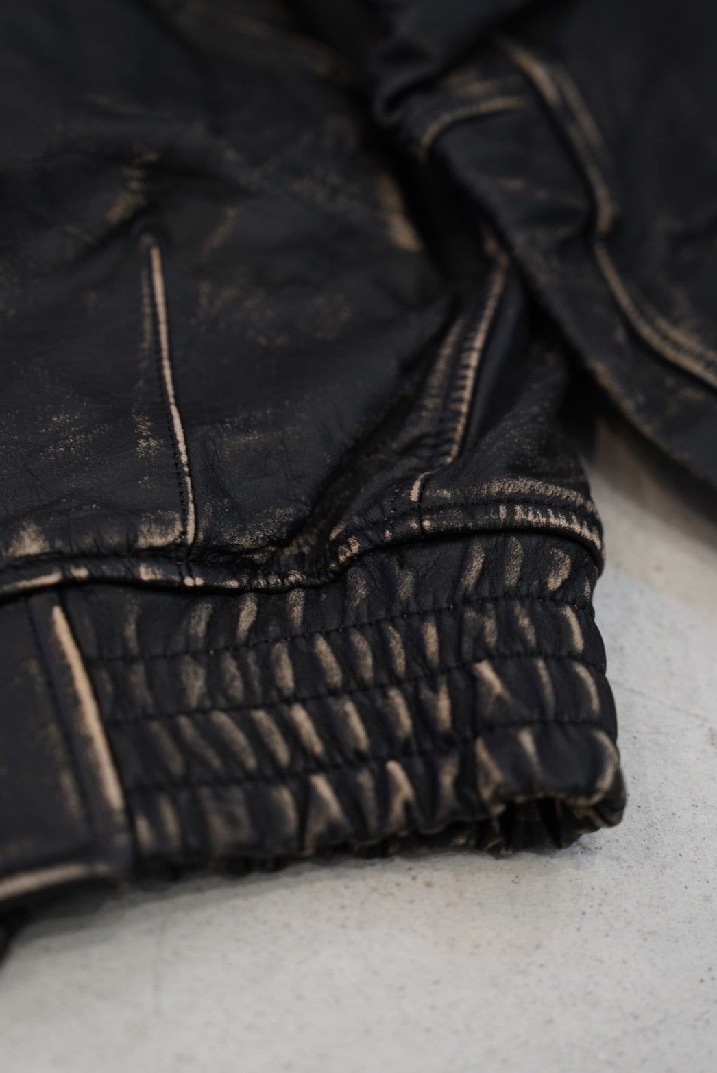 NVRFRGT DISTRESSED LEATHER BOMBER JACKET