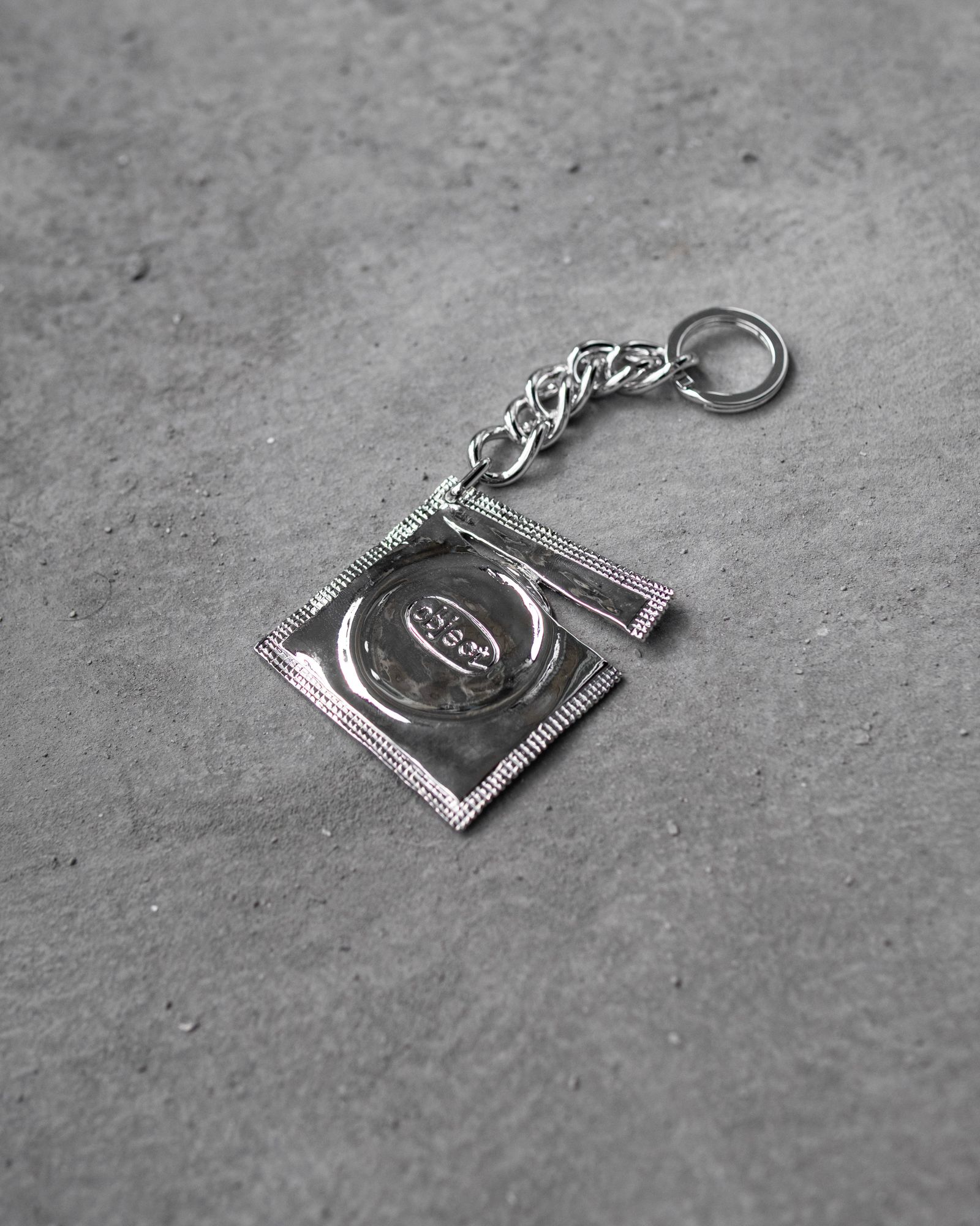 Ripped Raincoat Keyring / Silver