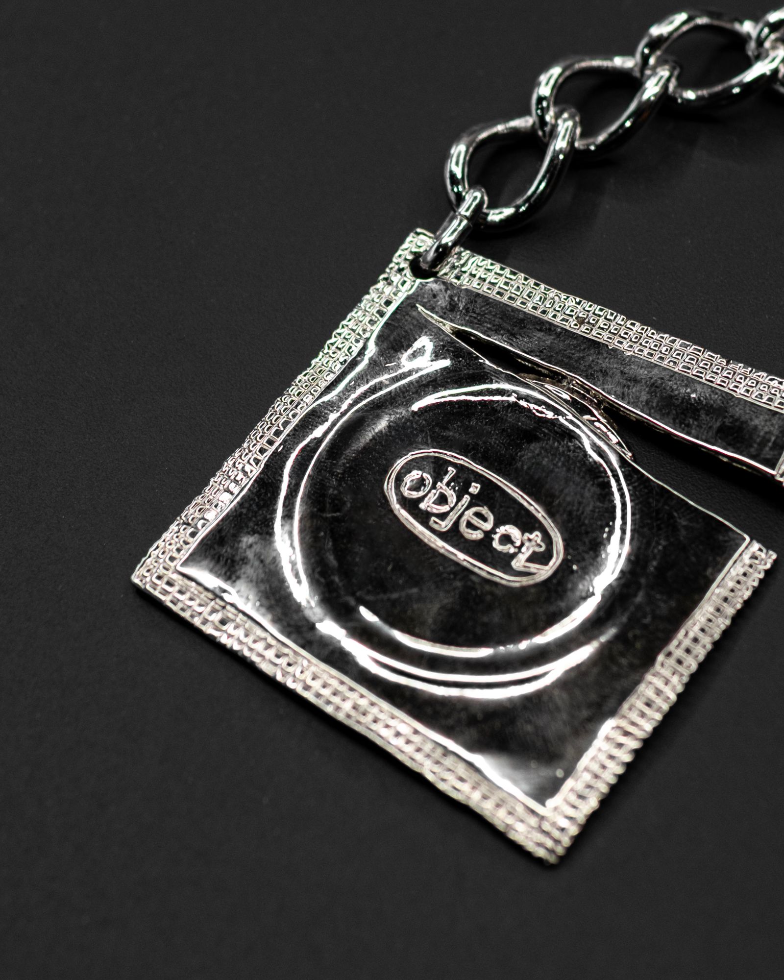 Ripped Raincoat Keyring / Silver