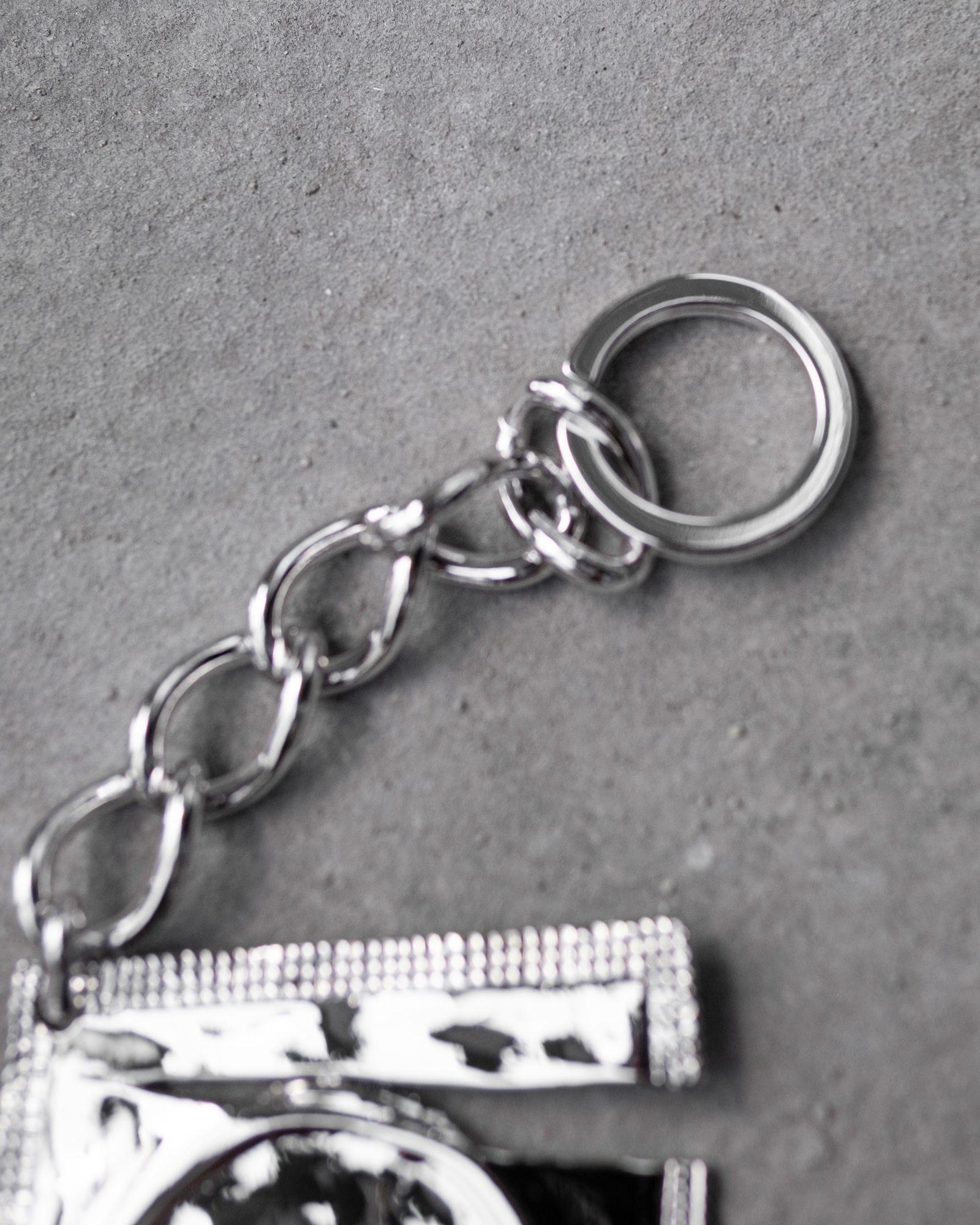 Ripped Raincoat Keyring / Silver