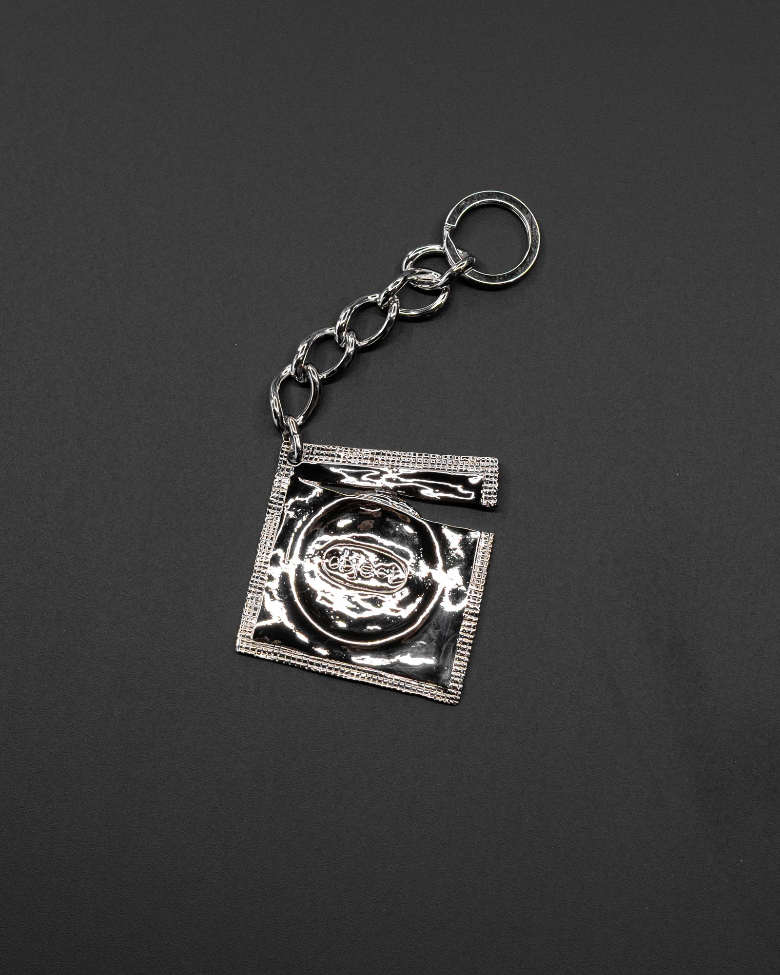 Ripped Raincoat Keyring / Silver